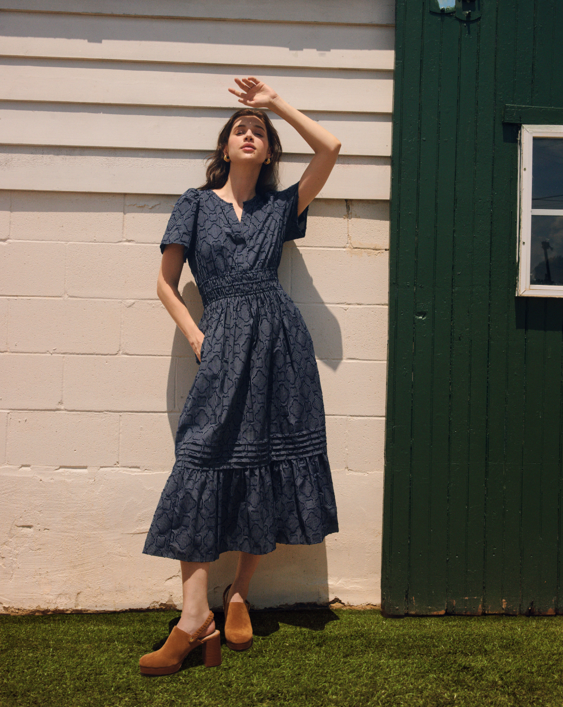 detail crop of flutter sleeve and smocked waist