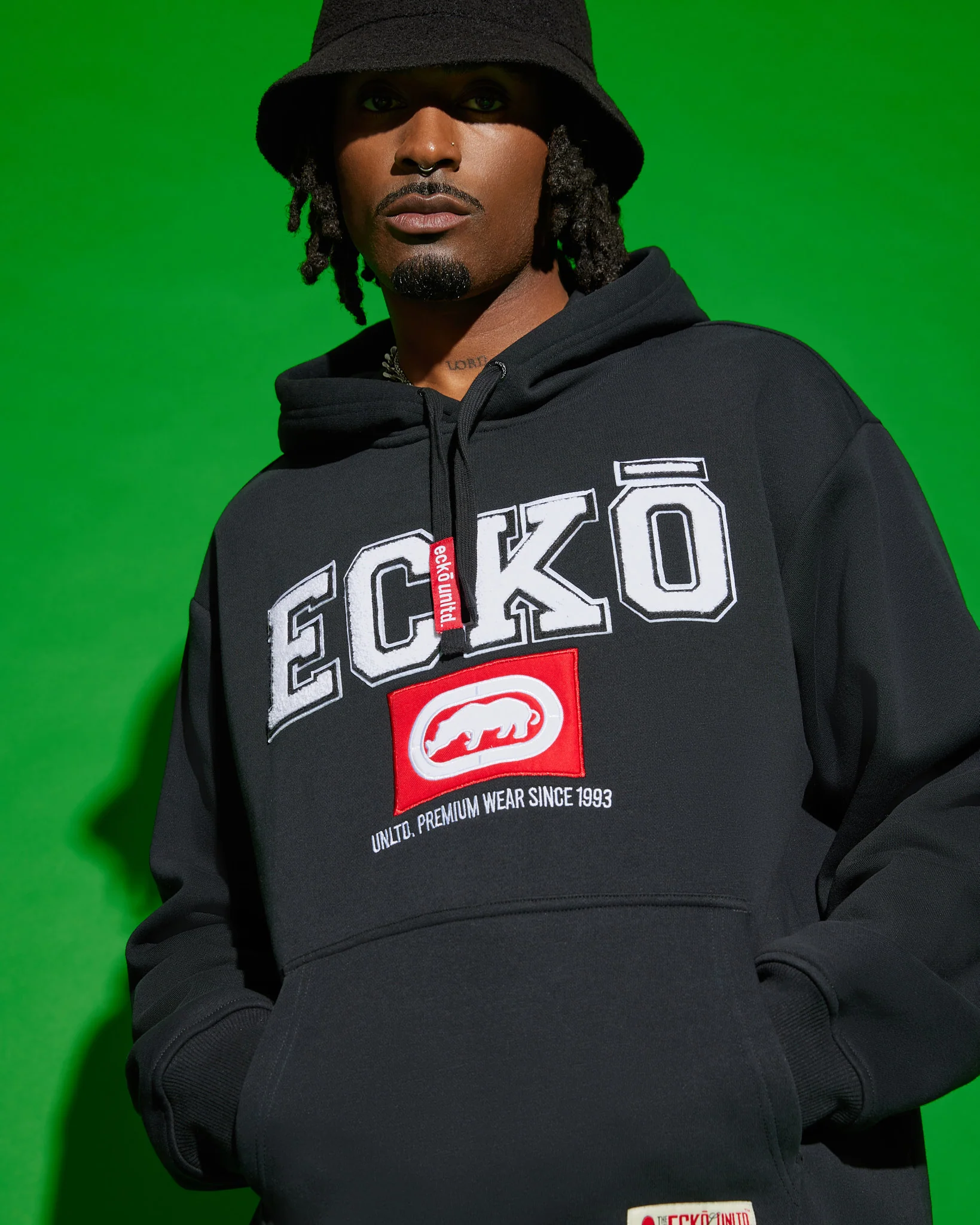 Studio view showing hoodie volume and drawcord hood