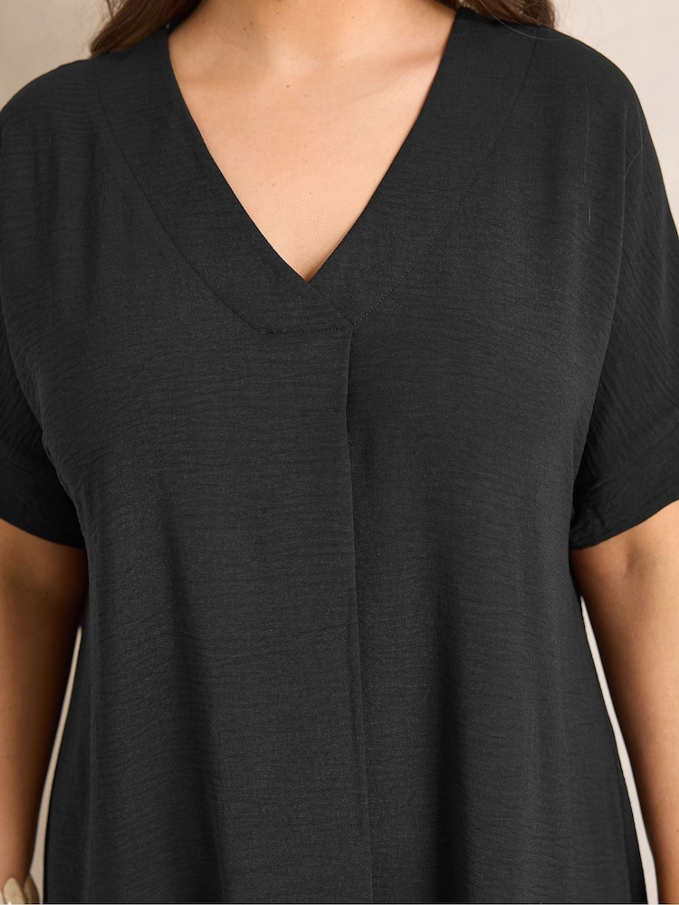 Pleated neckline detail