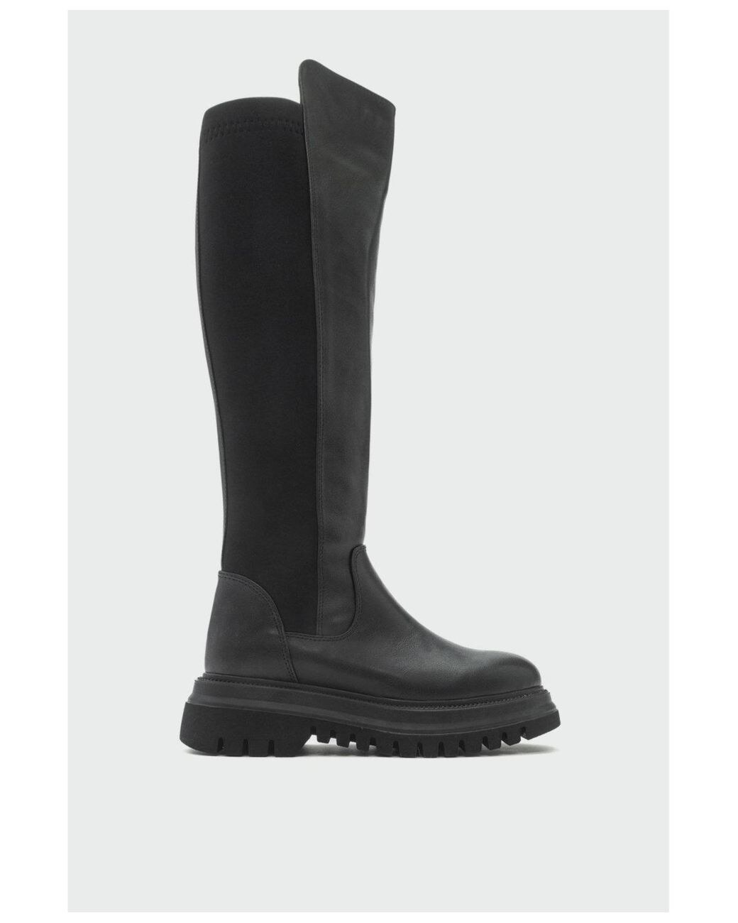 tall black boot profile with lugged sole