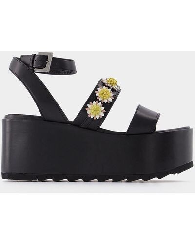 side profile showing the high platform and ankle strap