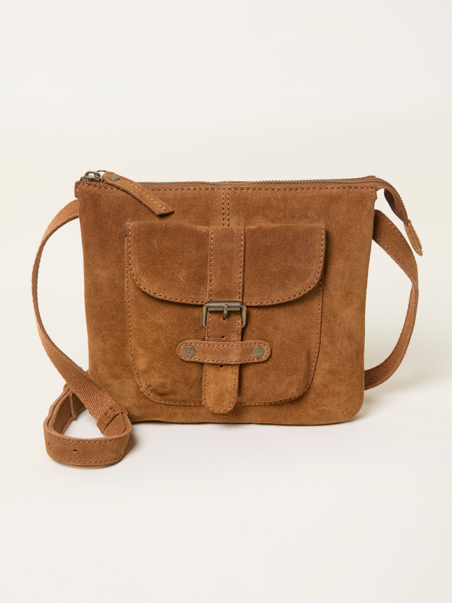 Libby Tan Brown Suede Crossbody Bag — location still life