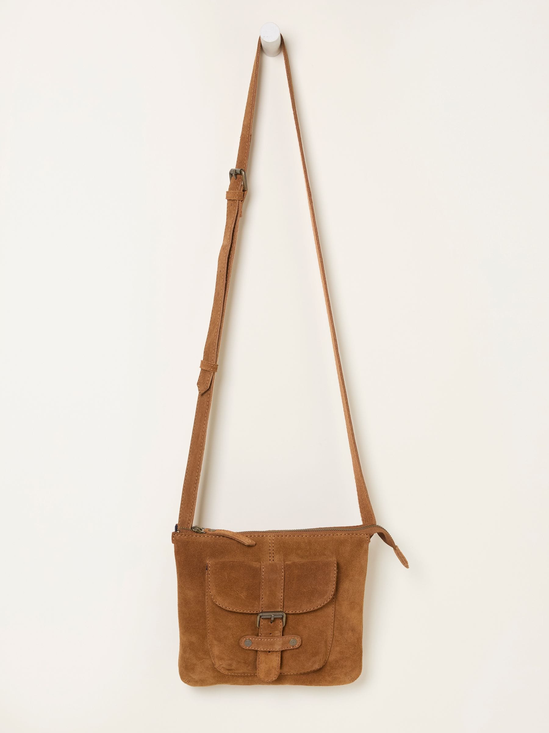 Libby Tan Brown Suede Crossbody Bag — location still life