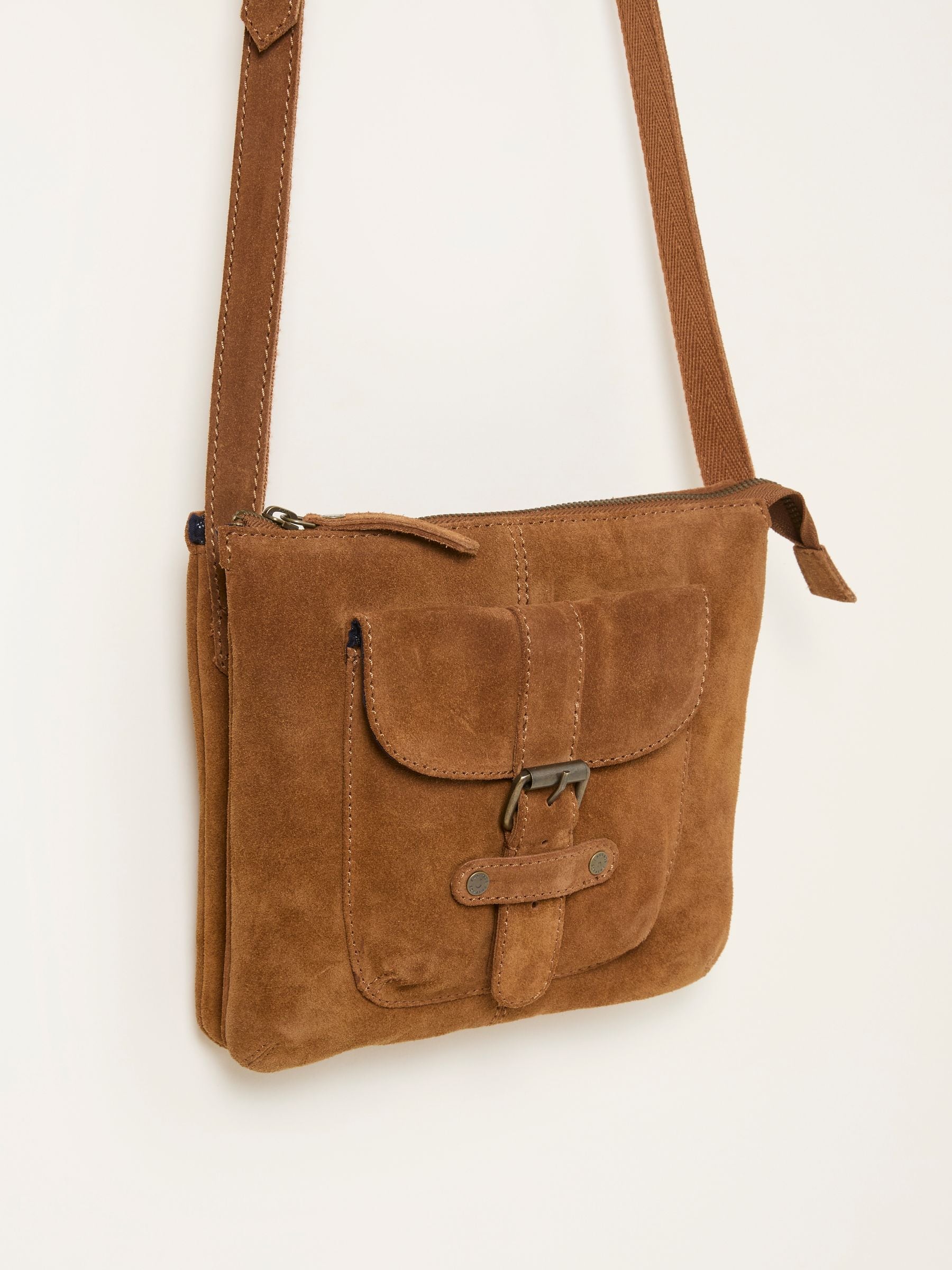 Libby Tan Brown Suede Crossbody Bag — location still life