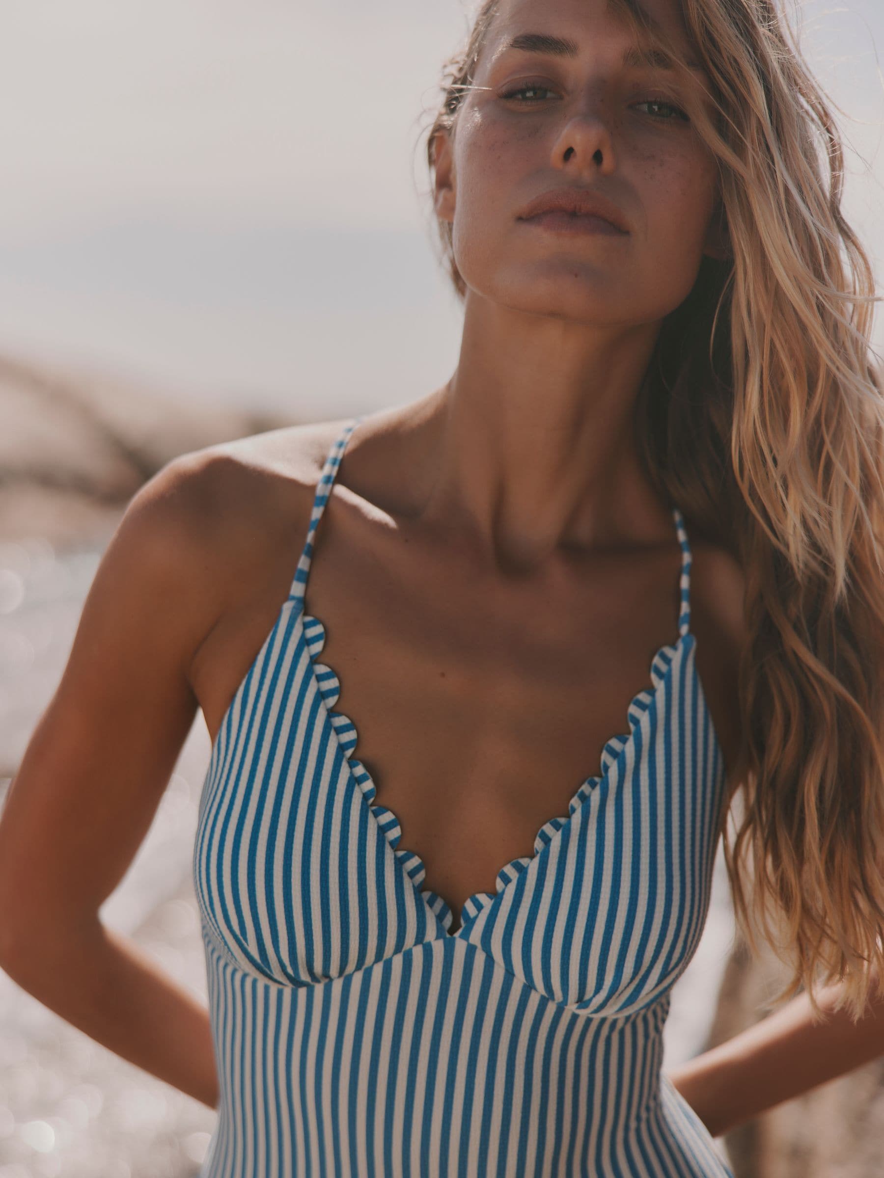 Blue and White Stripe Textured Swimsuit — location worn