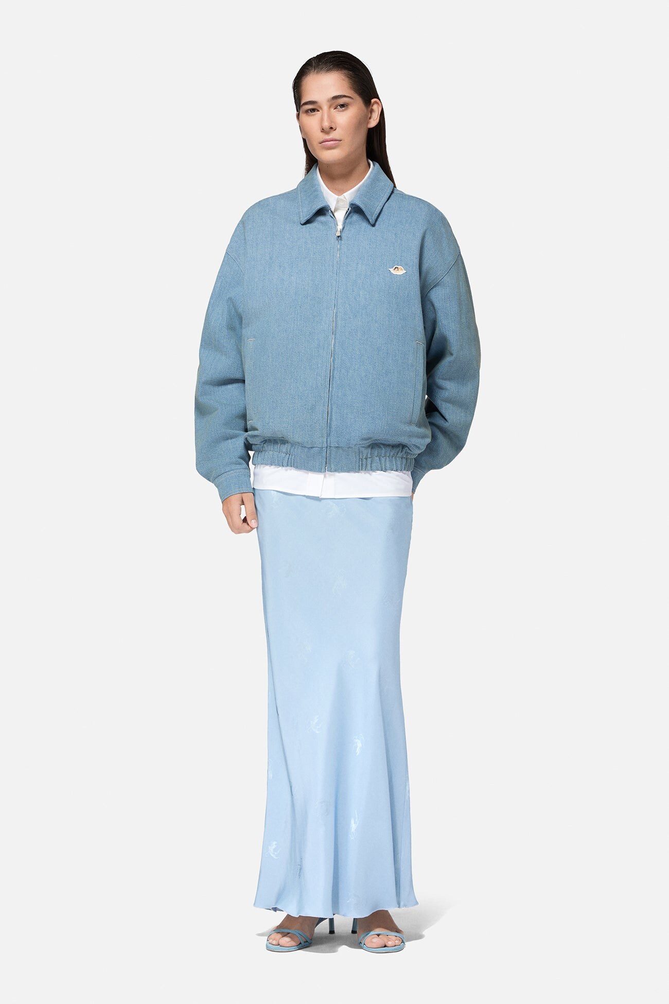worn open over pale denim
