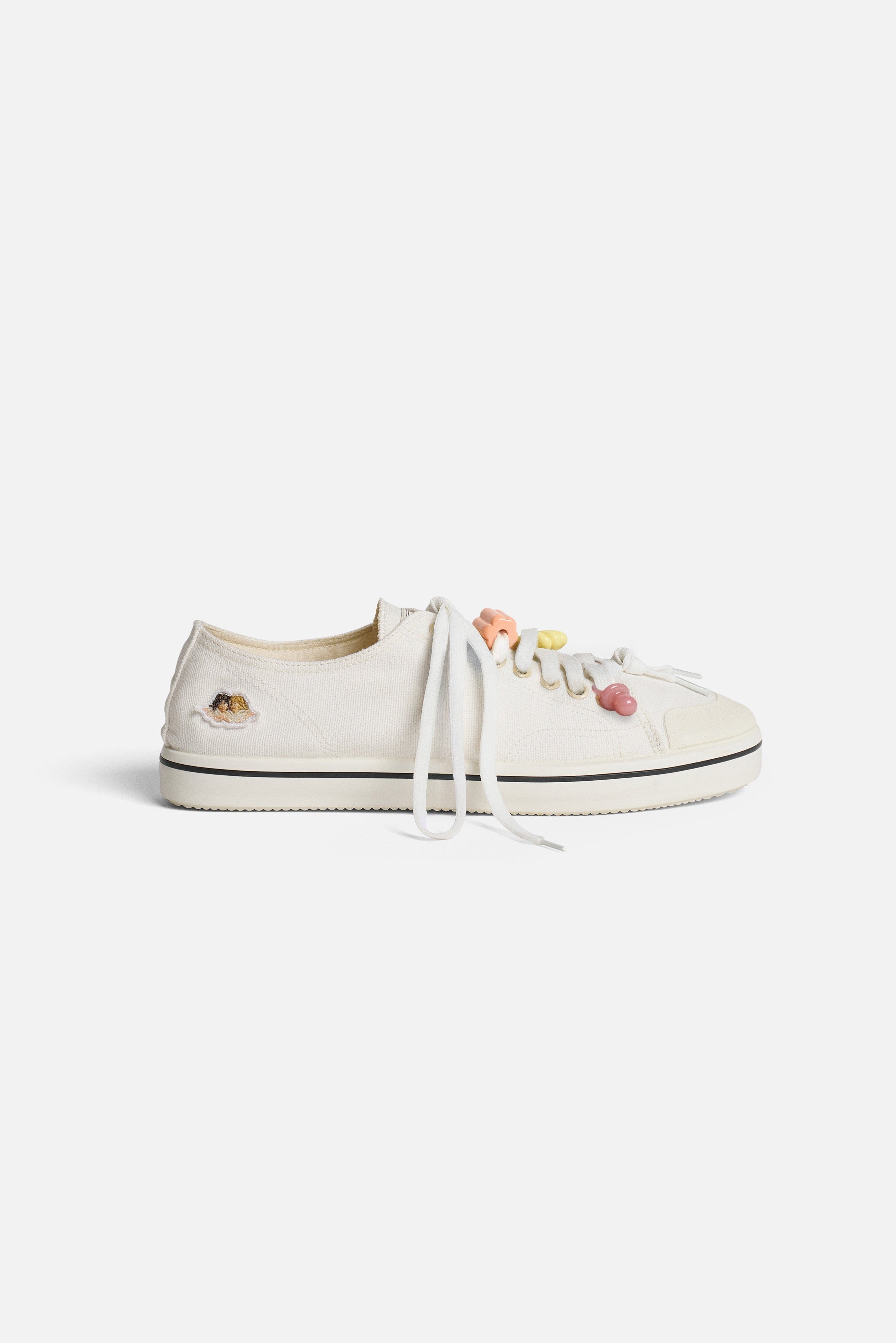 side profile with red stitching and patch detail