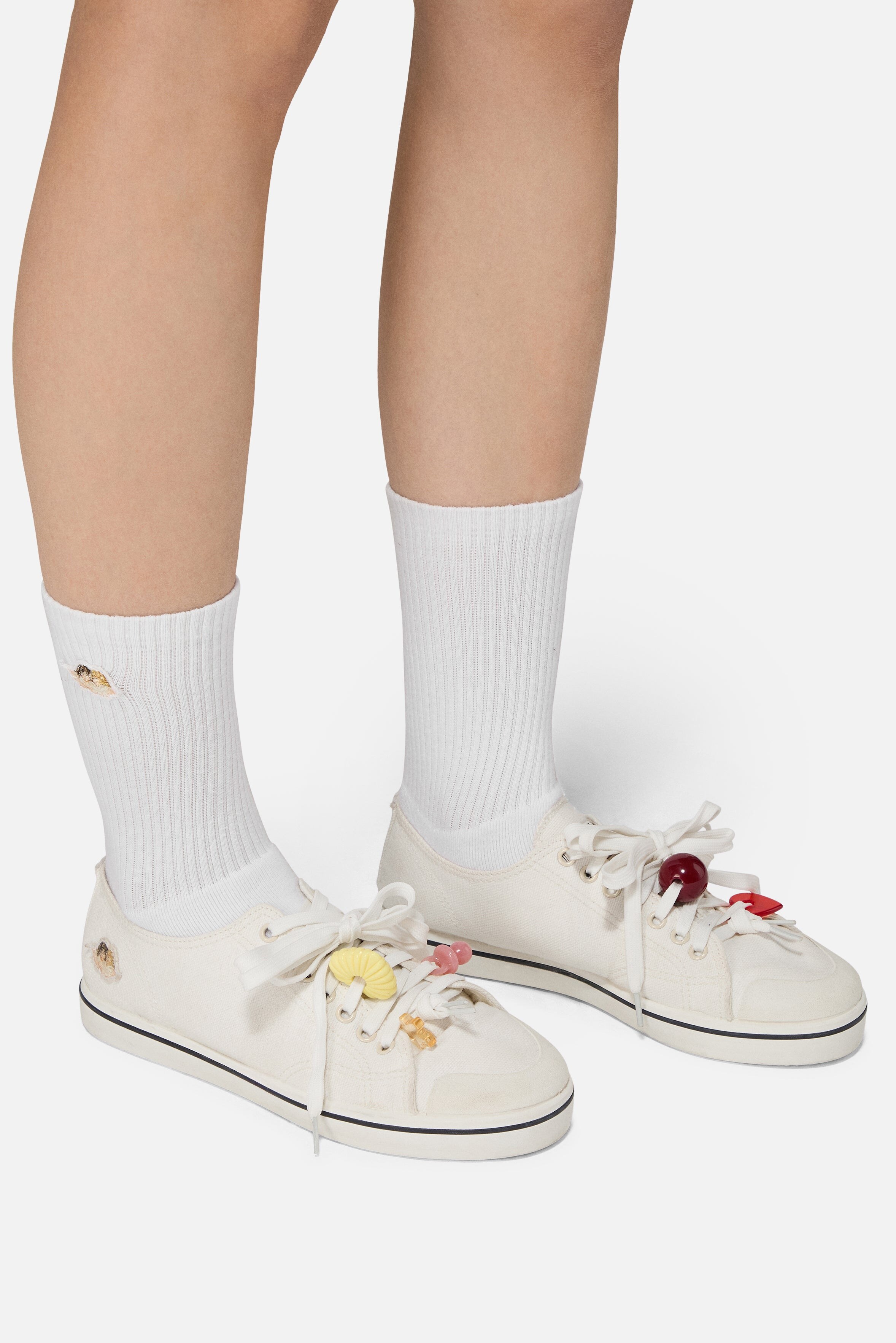 worn with white socks to show the low-top shape