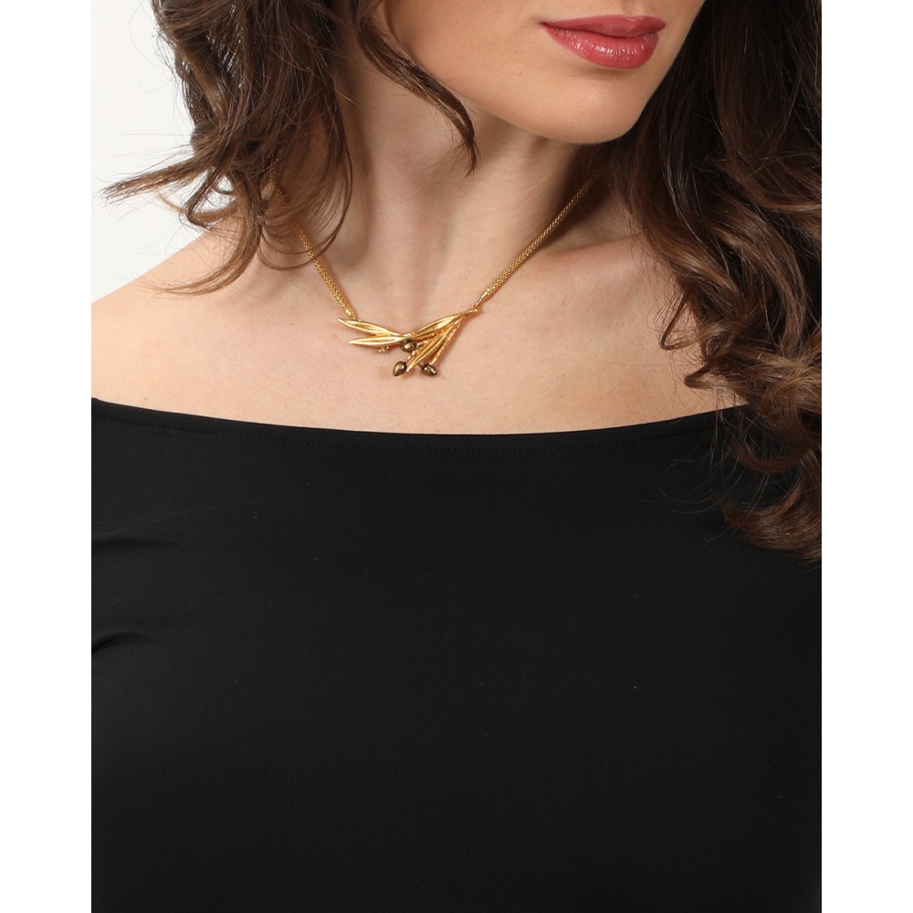 necklace worn layered at the collarbone