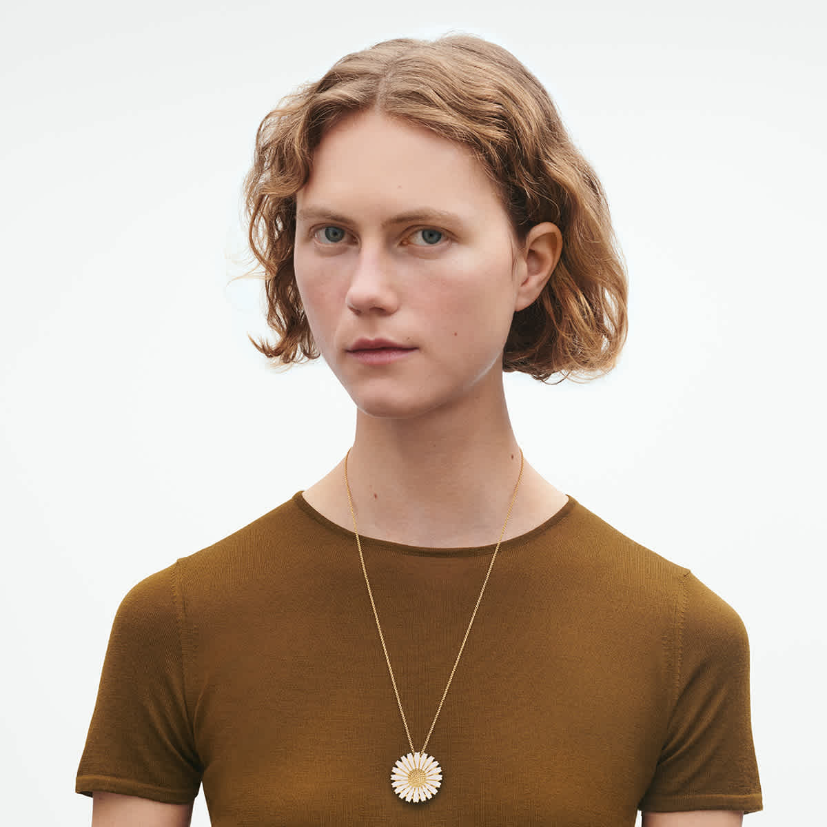 On-model scale of the white enamel Daisy pendant
