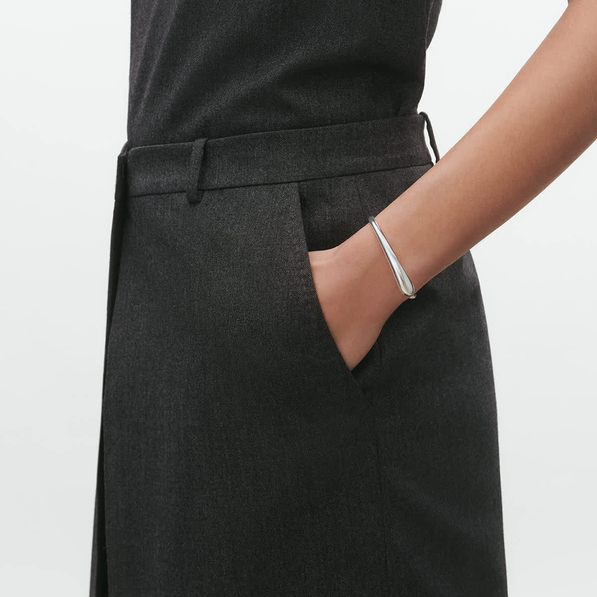 Open bangle worn with soft tailoring