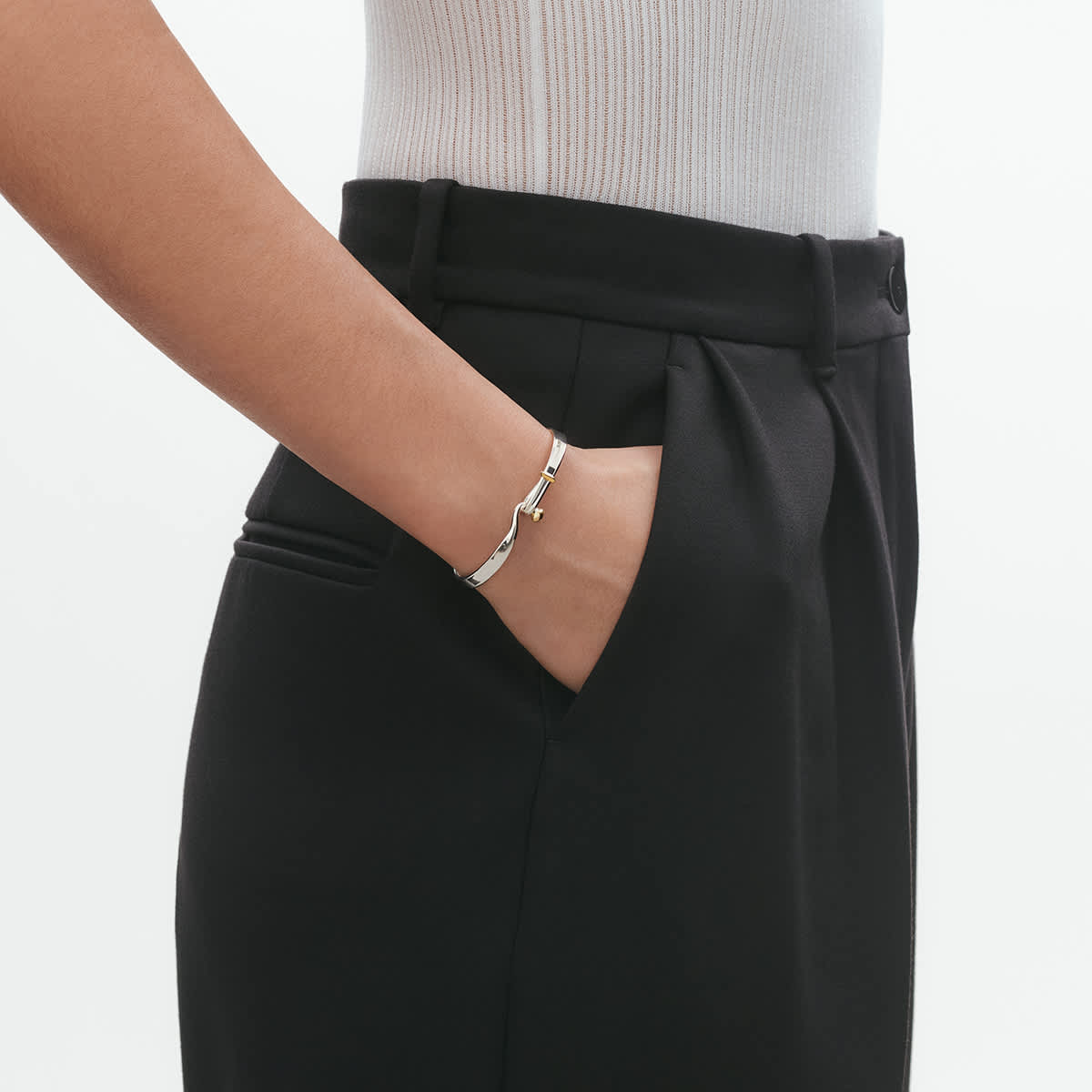 On-model scale of the silver and gold bangle