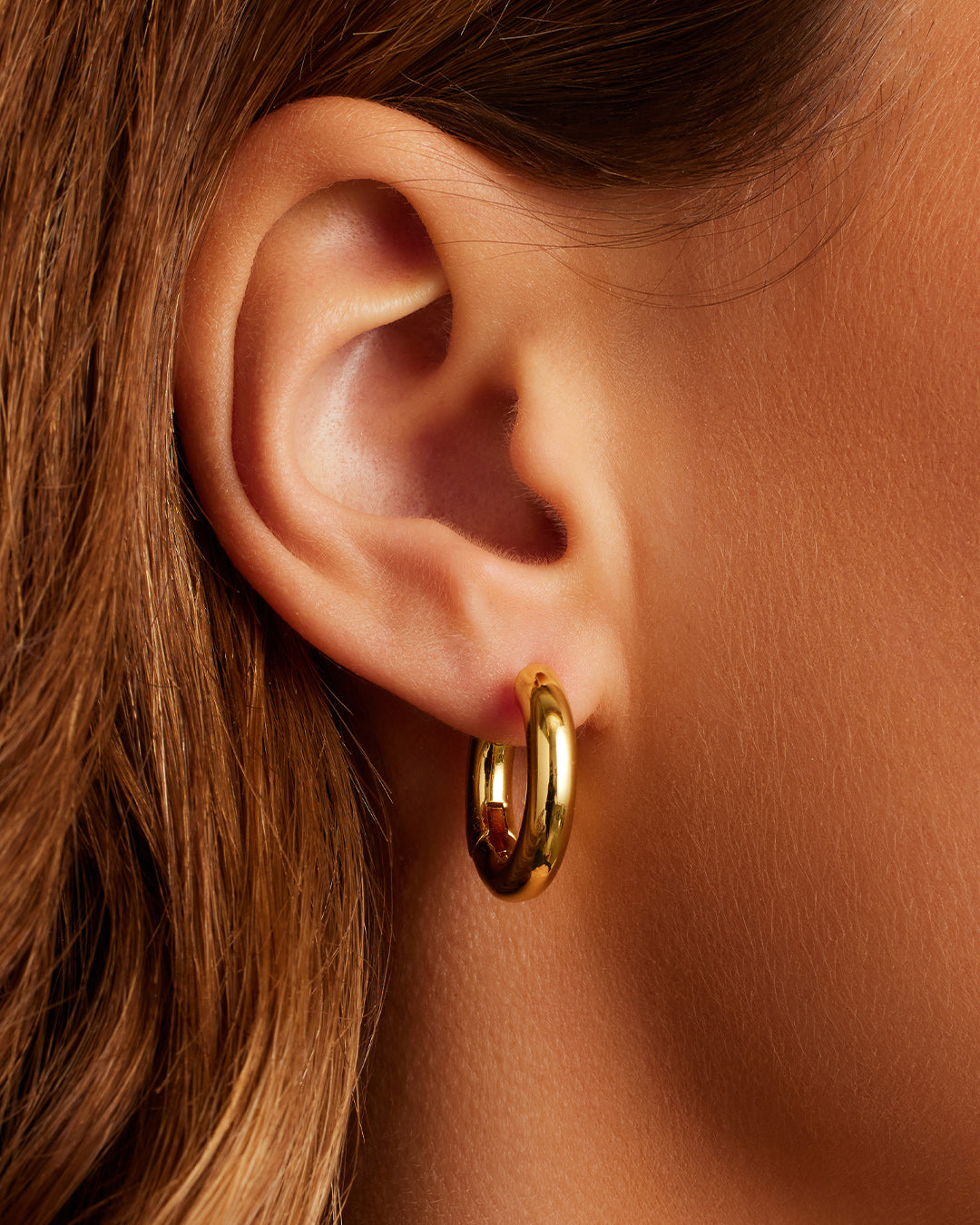 On model Lou Hoops chunky hoops bold hoop earrings