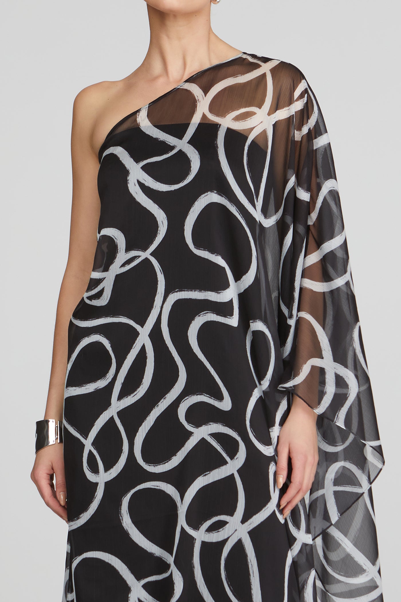 neckline close-up and sheer printed sleeve