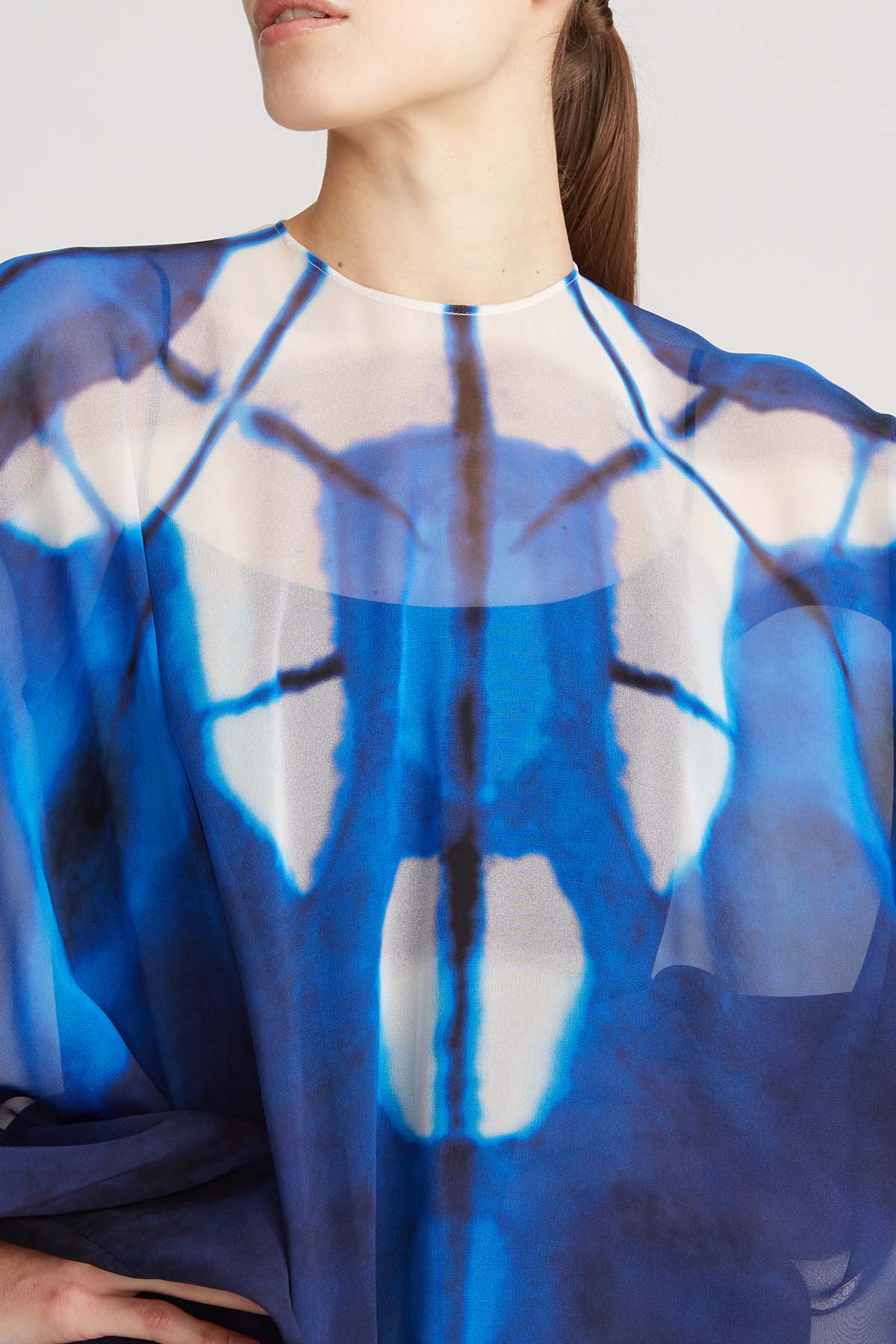 neckline close-up showing the airy printed chiffon