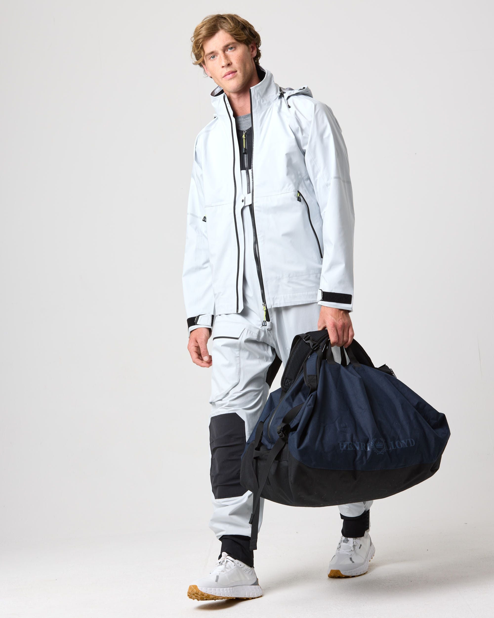 Model carrying the navy duffle