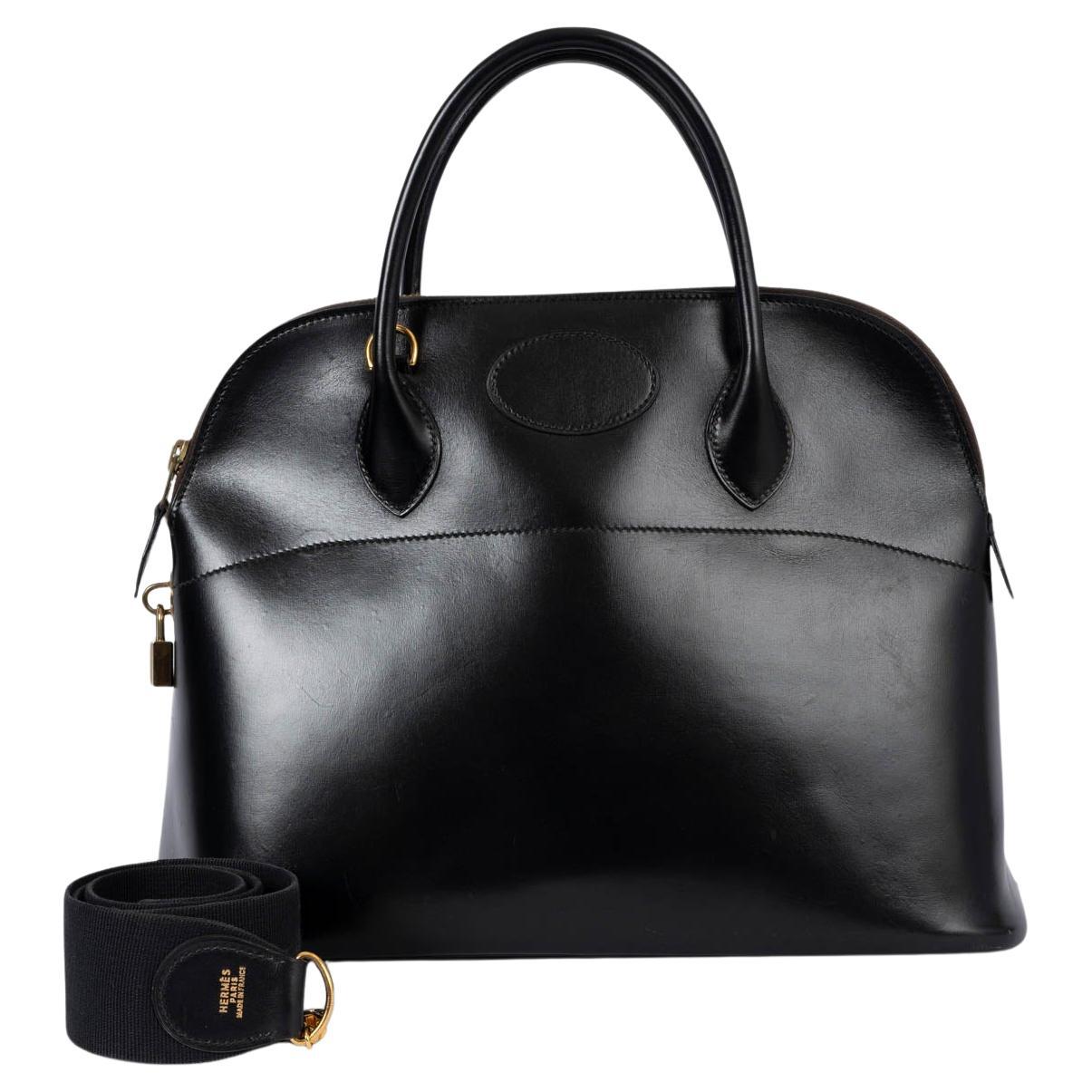 Black box-calf Bolide 35 with the canvas shoulder strap