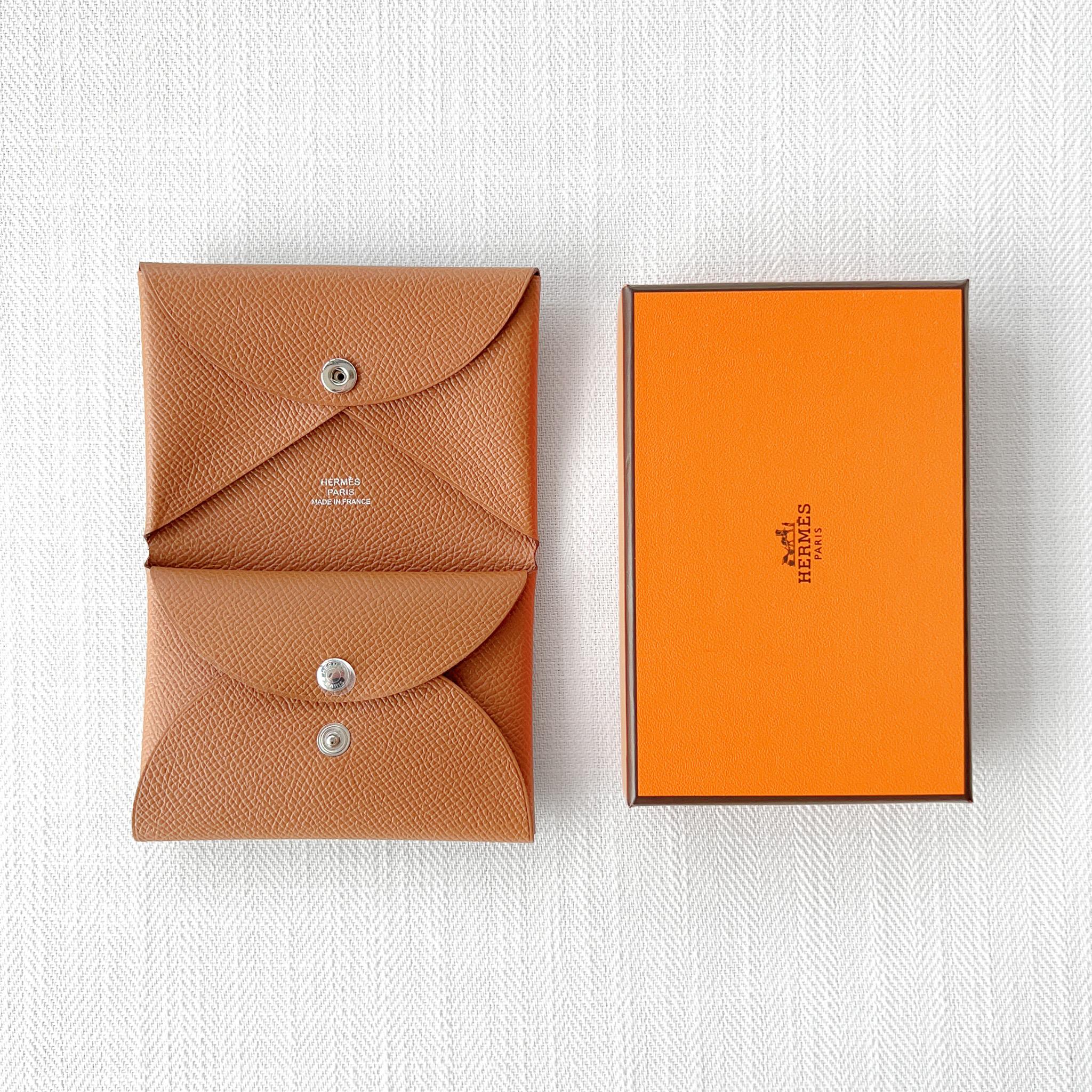 Tan Calvi beside its orange Hermès box