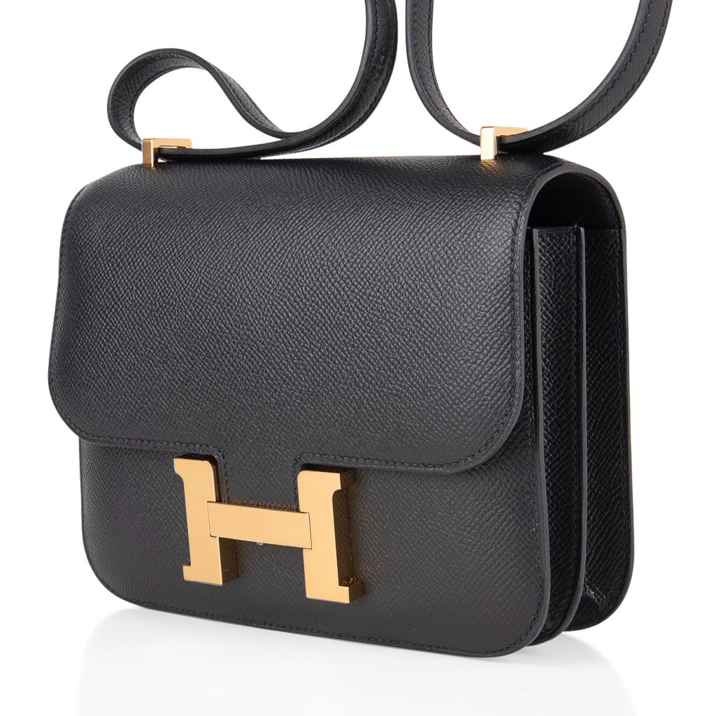 Detail of the gold H clasp on a black Epsom Constance