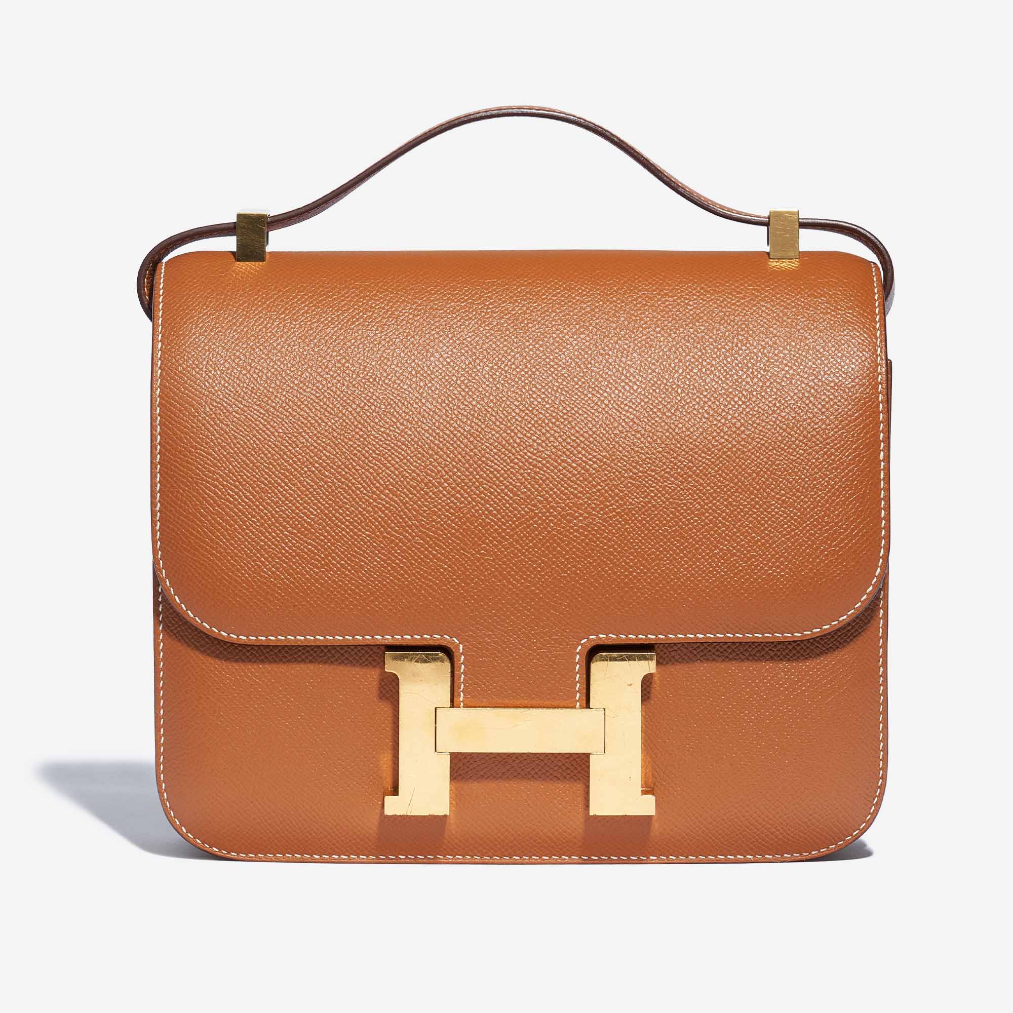 Tan Constance with the top handle folded over the flap