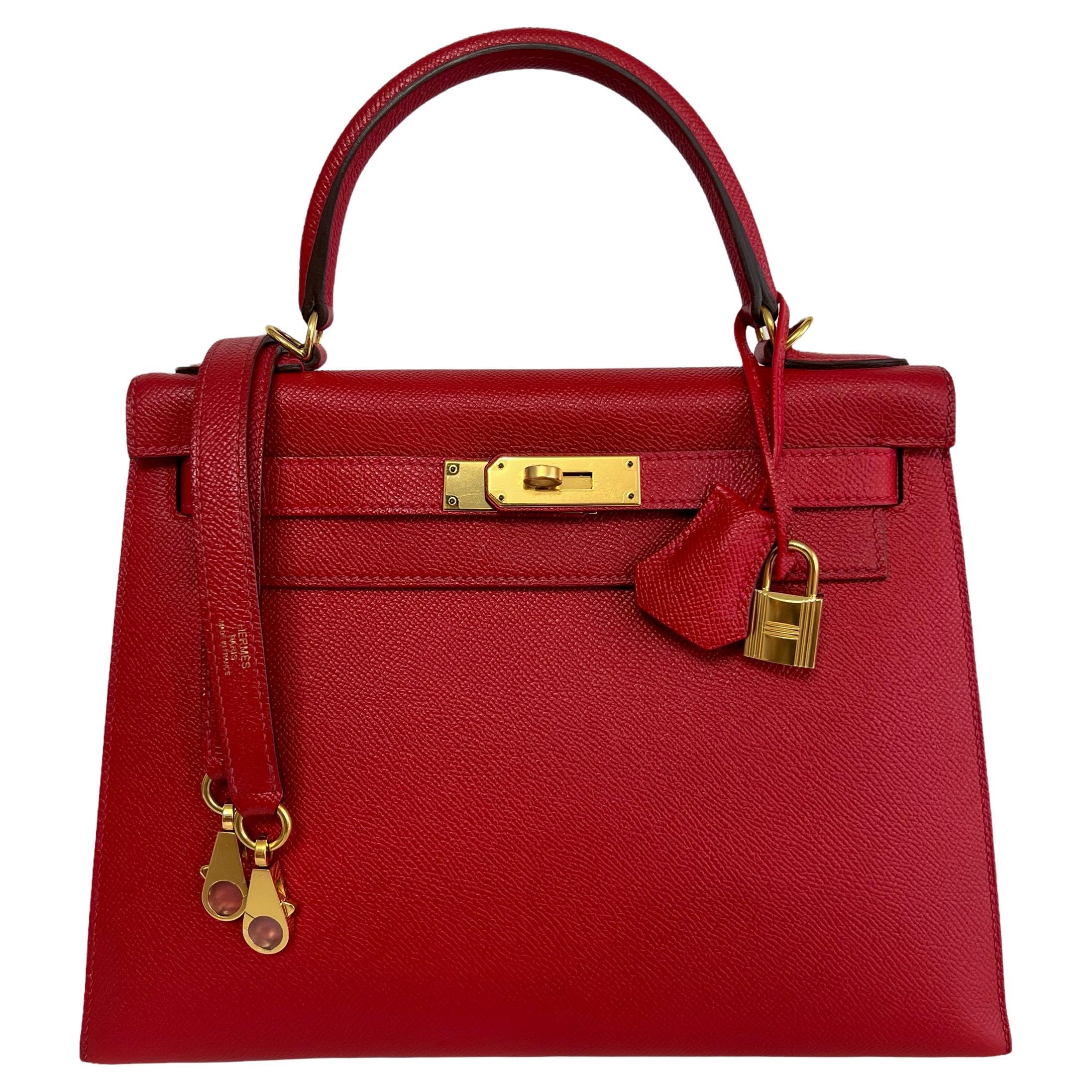 Kelly in rouge with gold hardware and detachable strap clasps