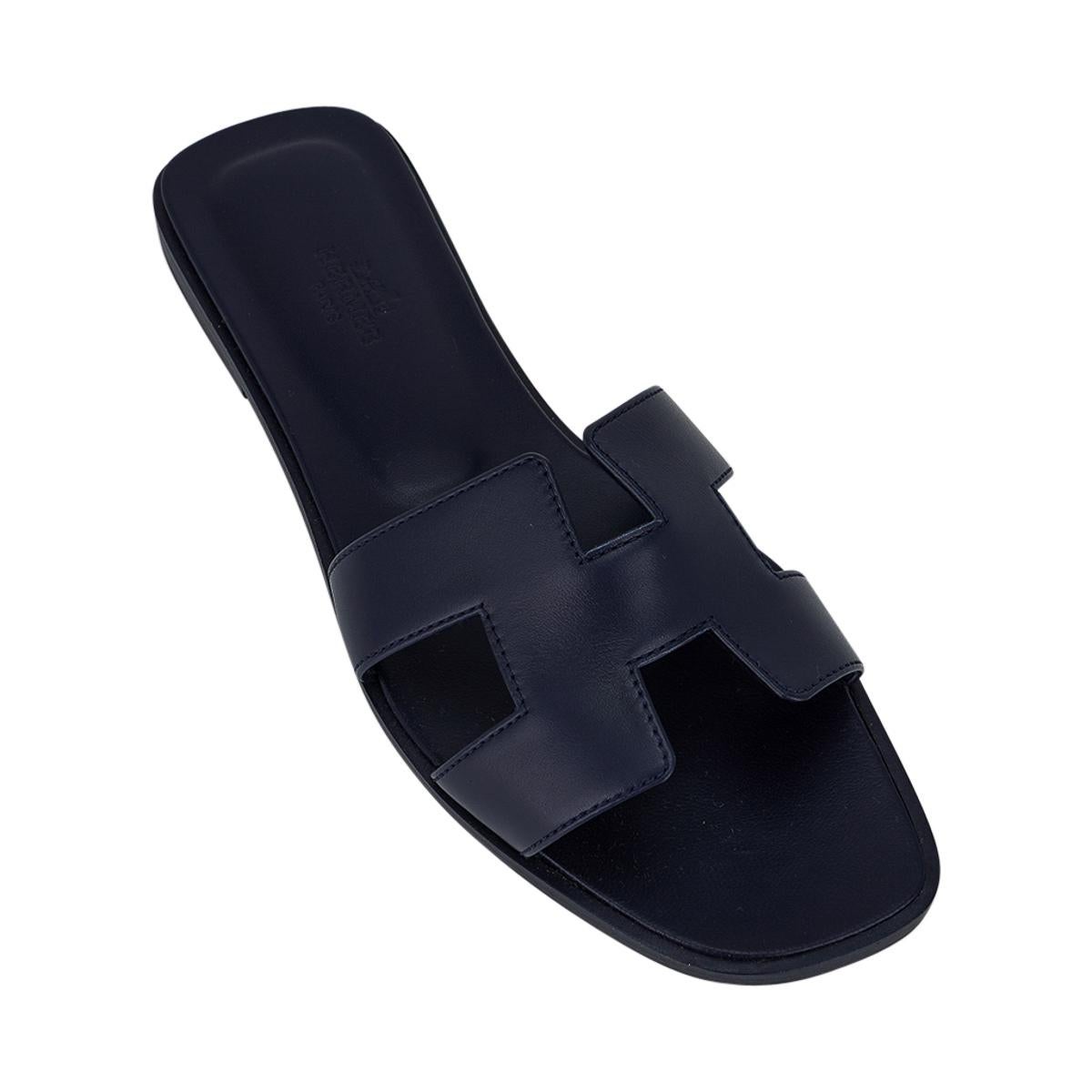 Navy Oran three-quarter view showing the squared toe