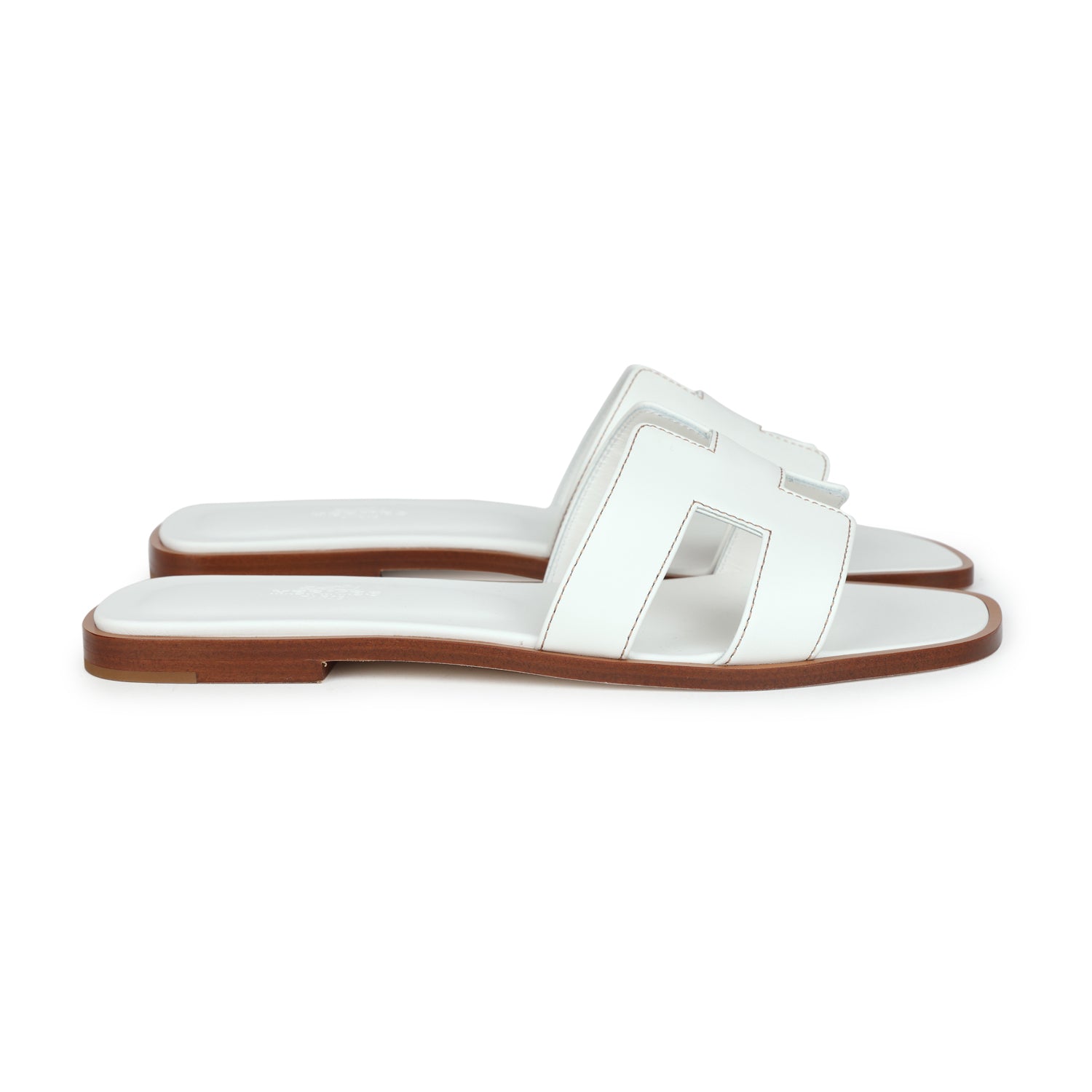 White Oran side profile — the slim flat construction