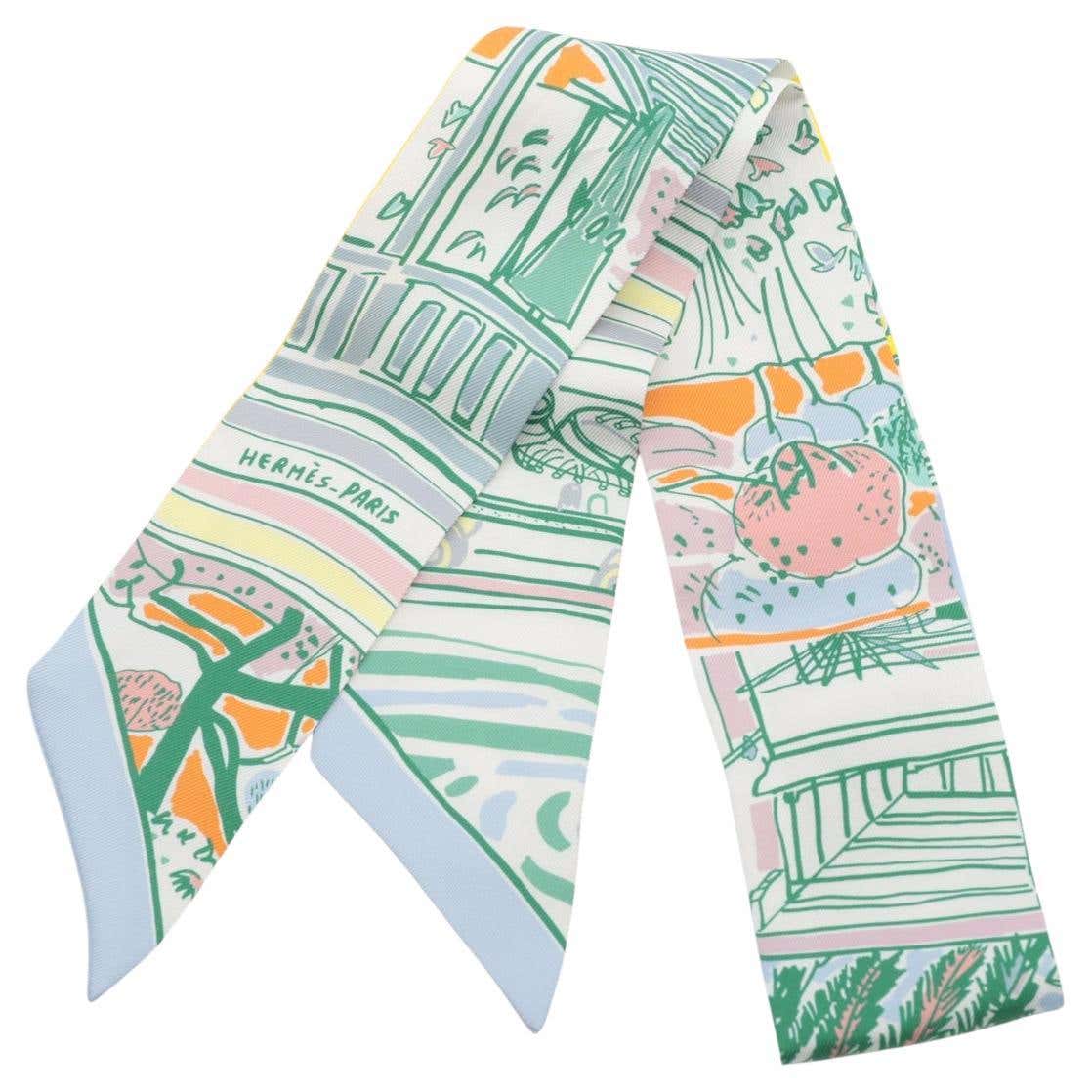 Pastel garden-print Twilly with the HERMÈS-PARIS signature visible
