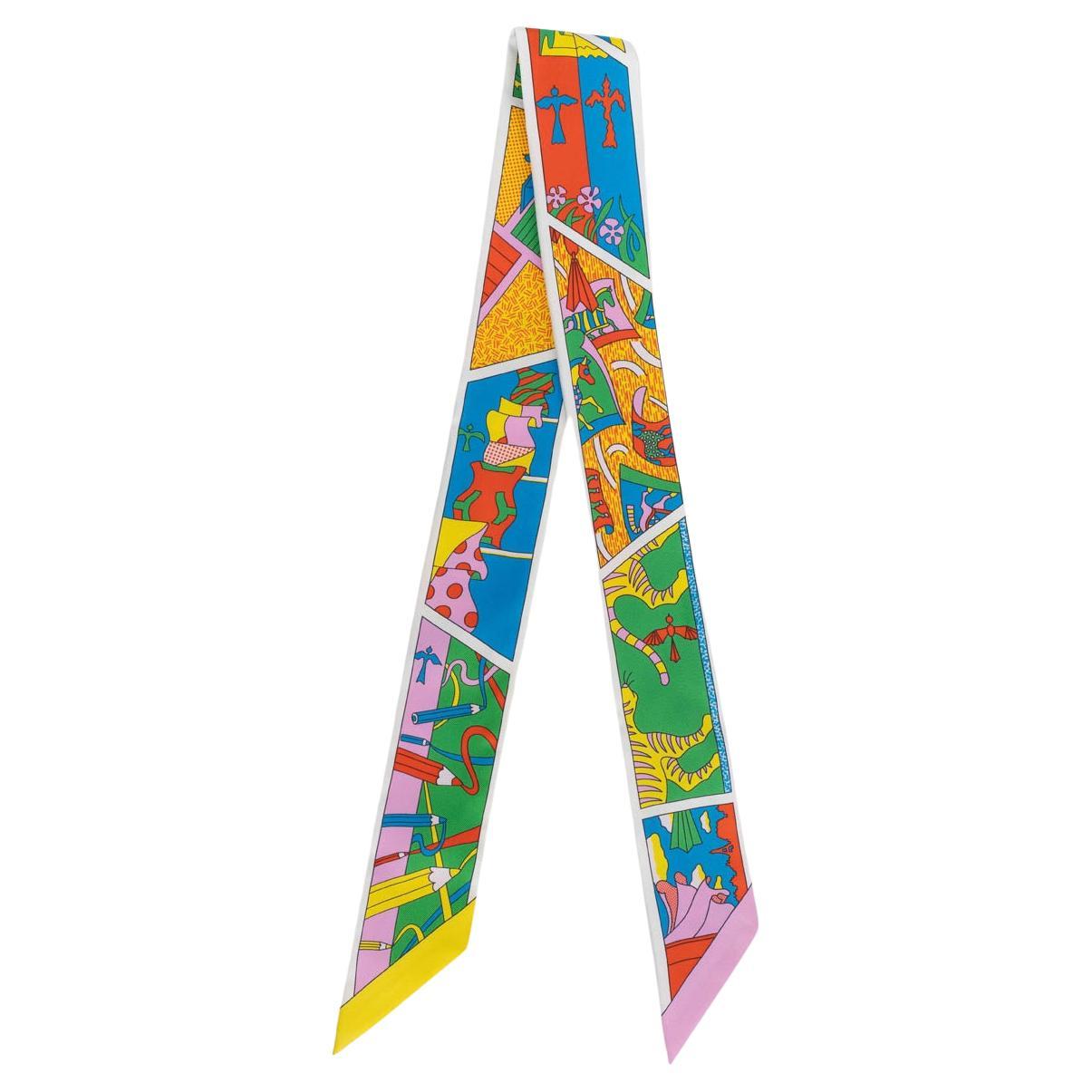 Bright graphic Twilly showing the pointed ends and rolled hems
