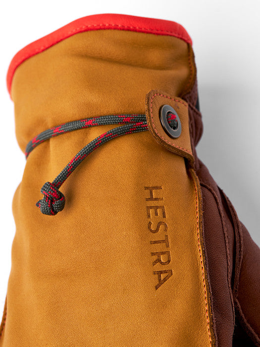 woven wrist cord and leather tab