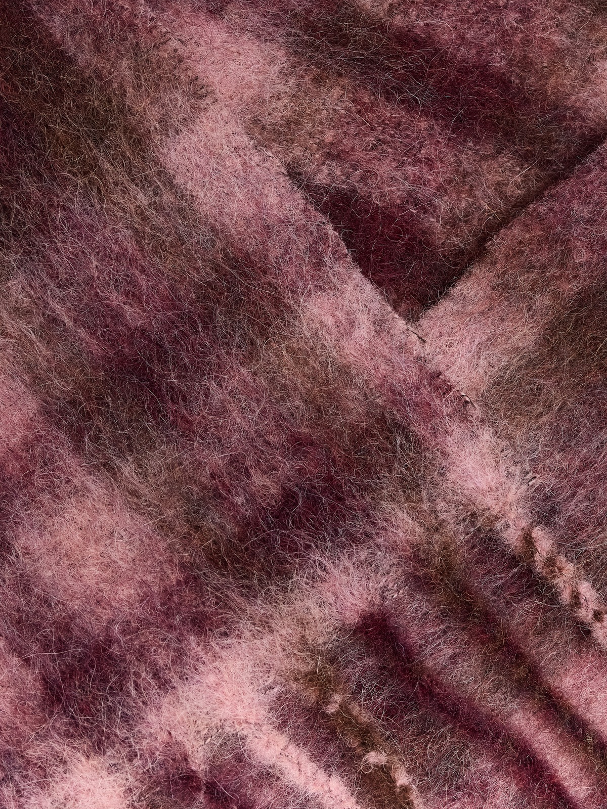 Mohair-rich check and fringe detail