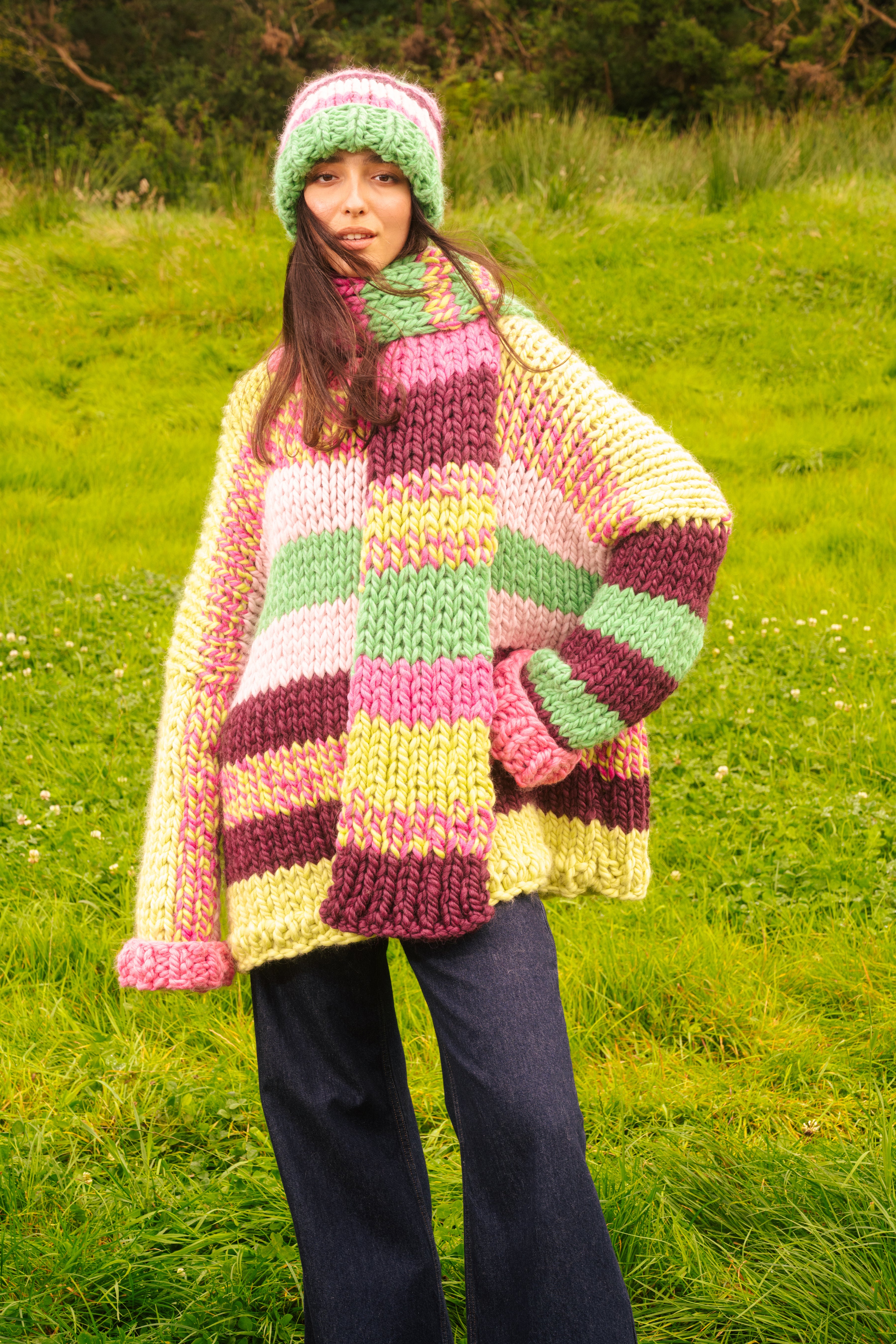 Full look showing the scarf worn long with the matching hat