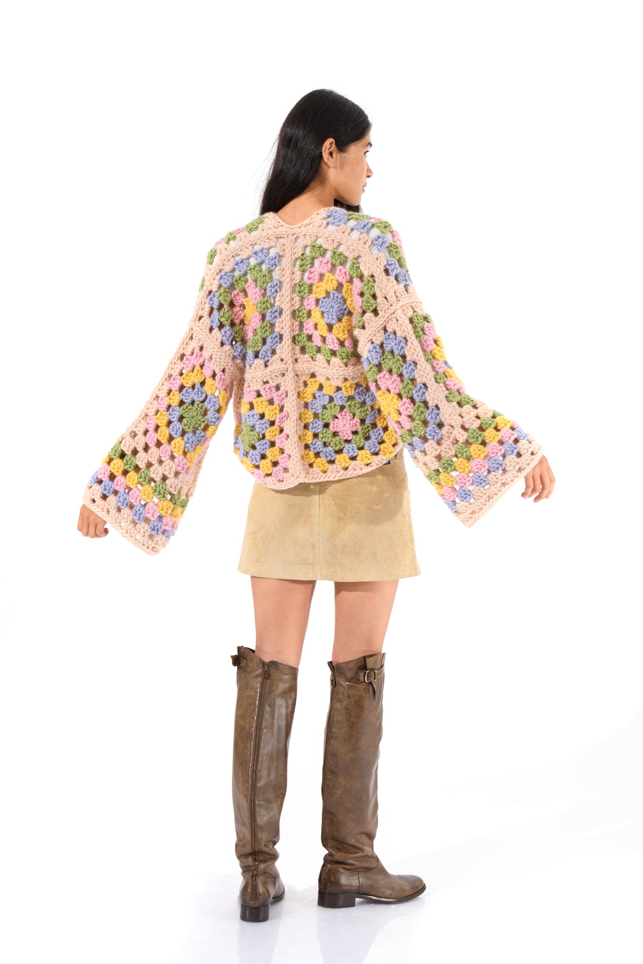 Side angle emphasizing the cardigan's drape and sleeve volume