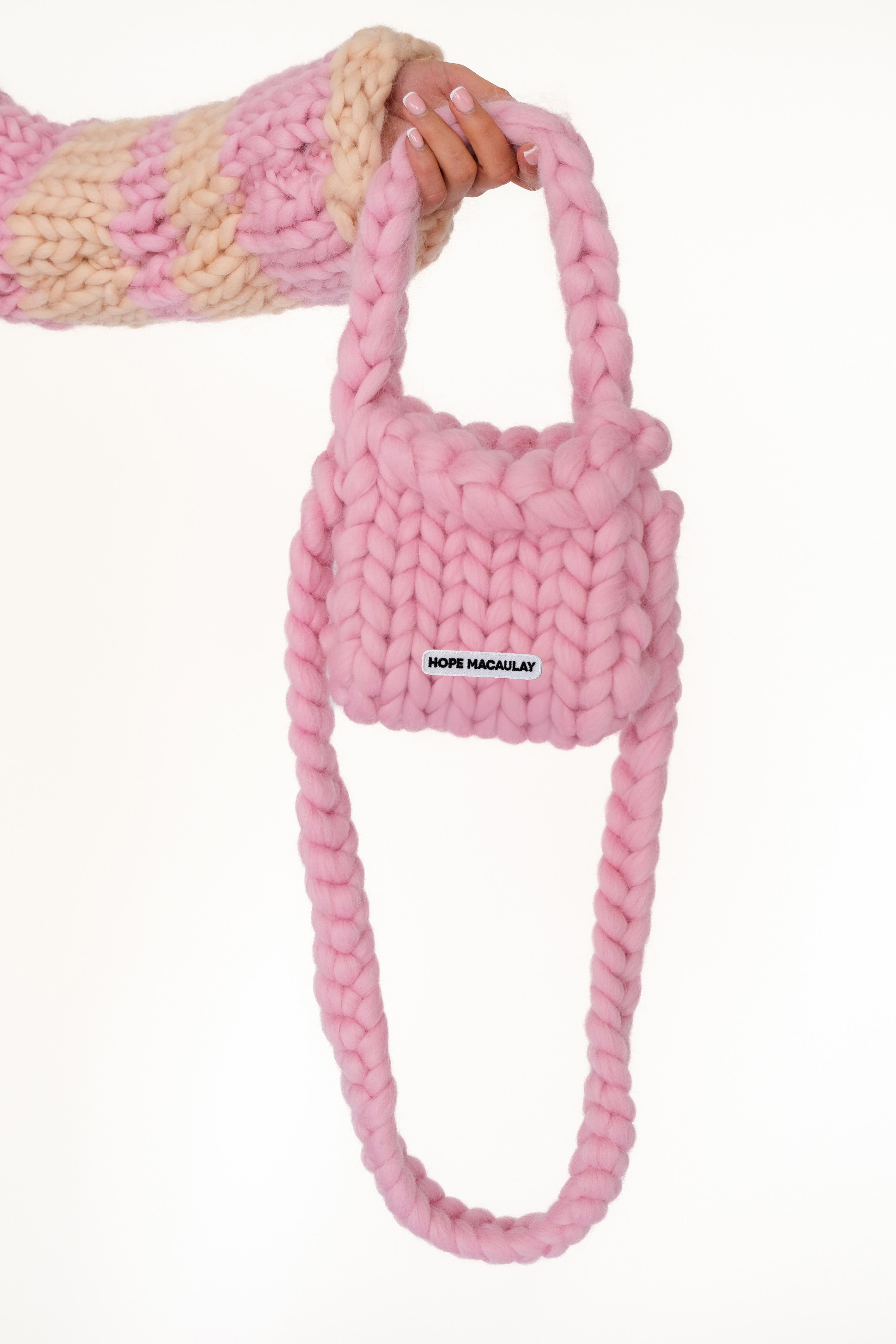 Side view emphasizing the small scale against the oversized stitch