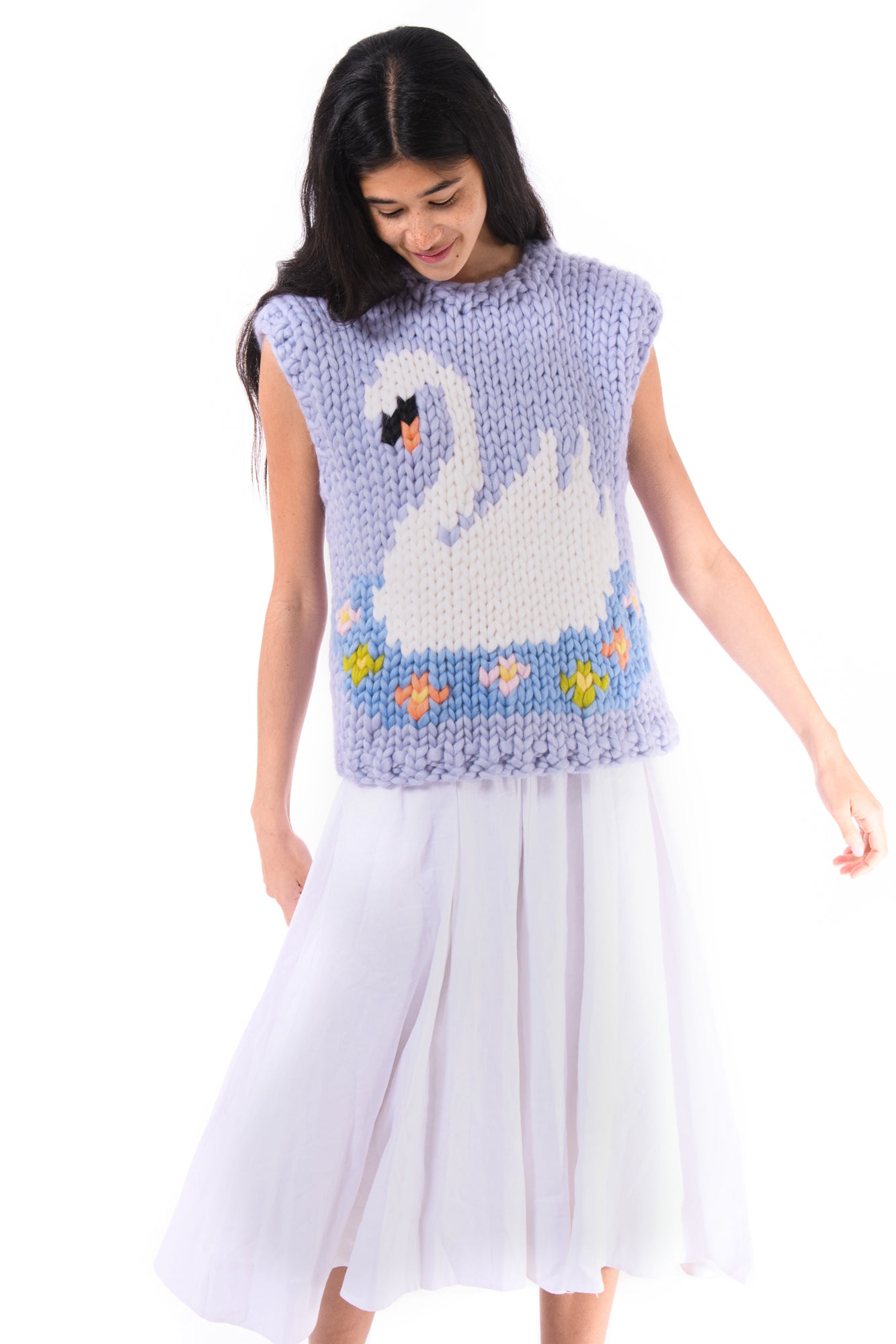 Movement shot of the vest over a soft skirt