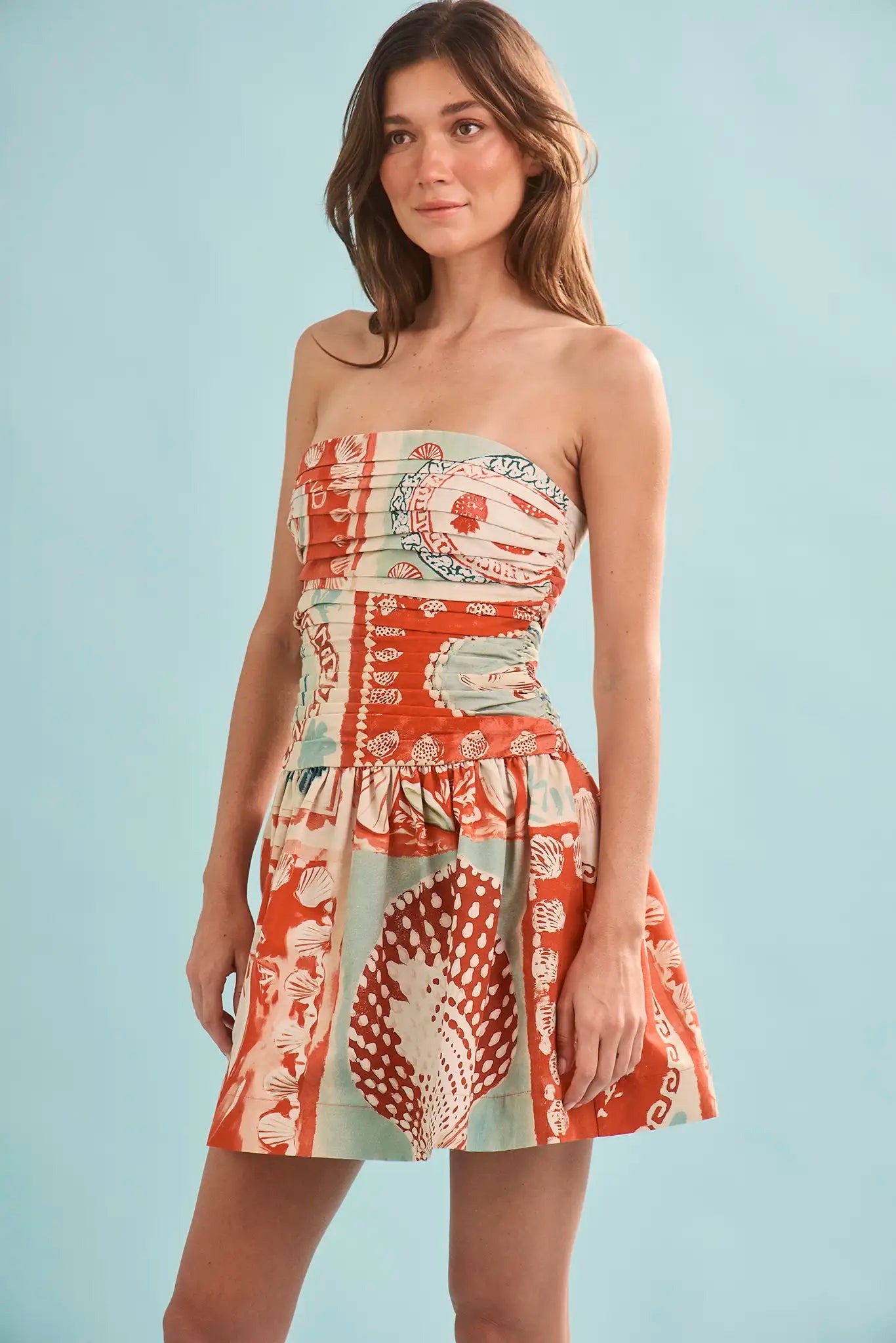 Studio front view of the short drop-waist silhouette