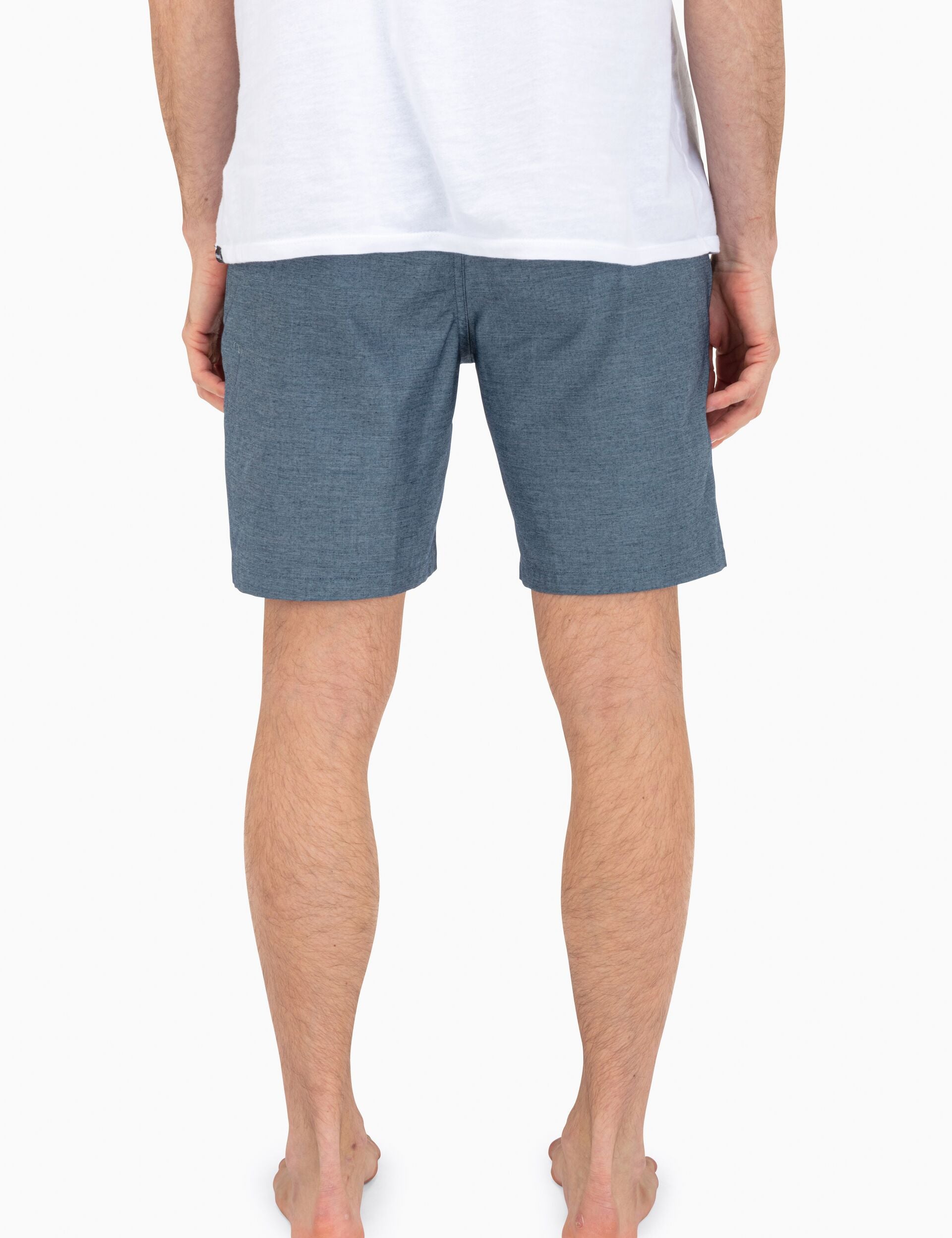 Rear view with welt pockets and tailored back.