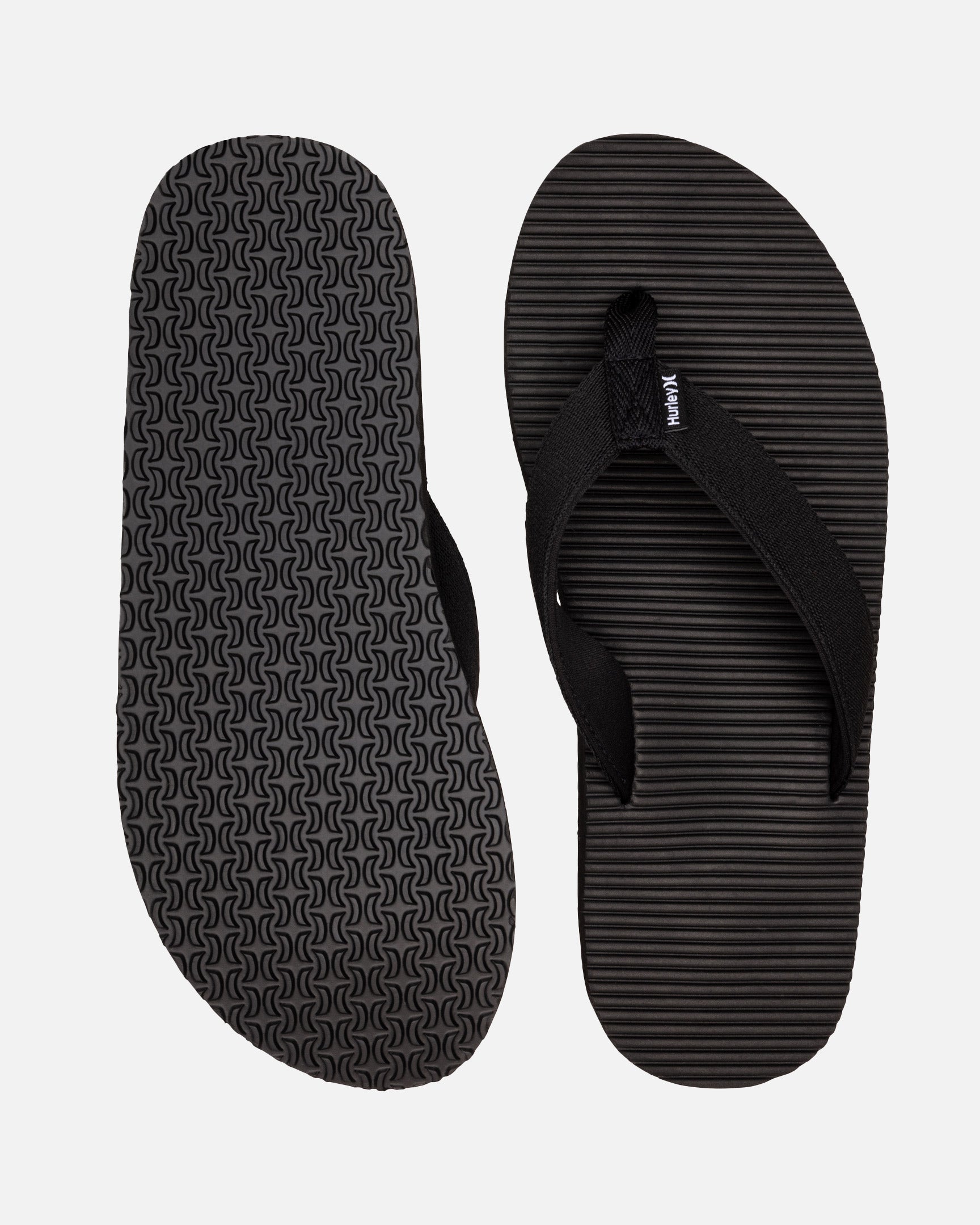 Black pair showing the logo-repeat outsole and footbed.