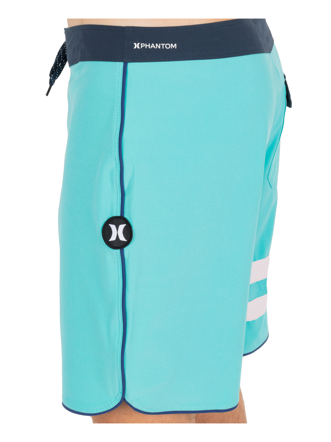 Close detail of the hem vent and circular logo hit.