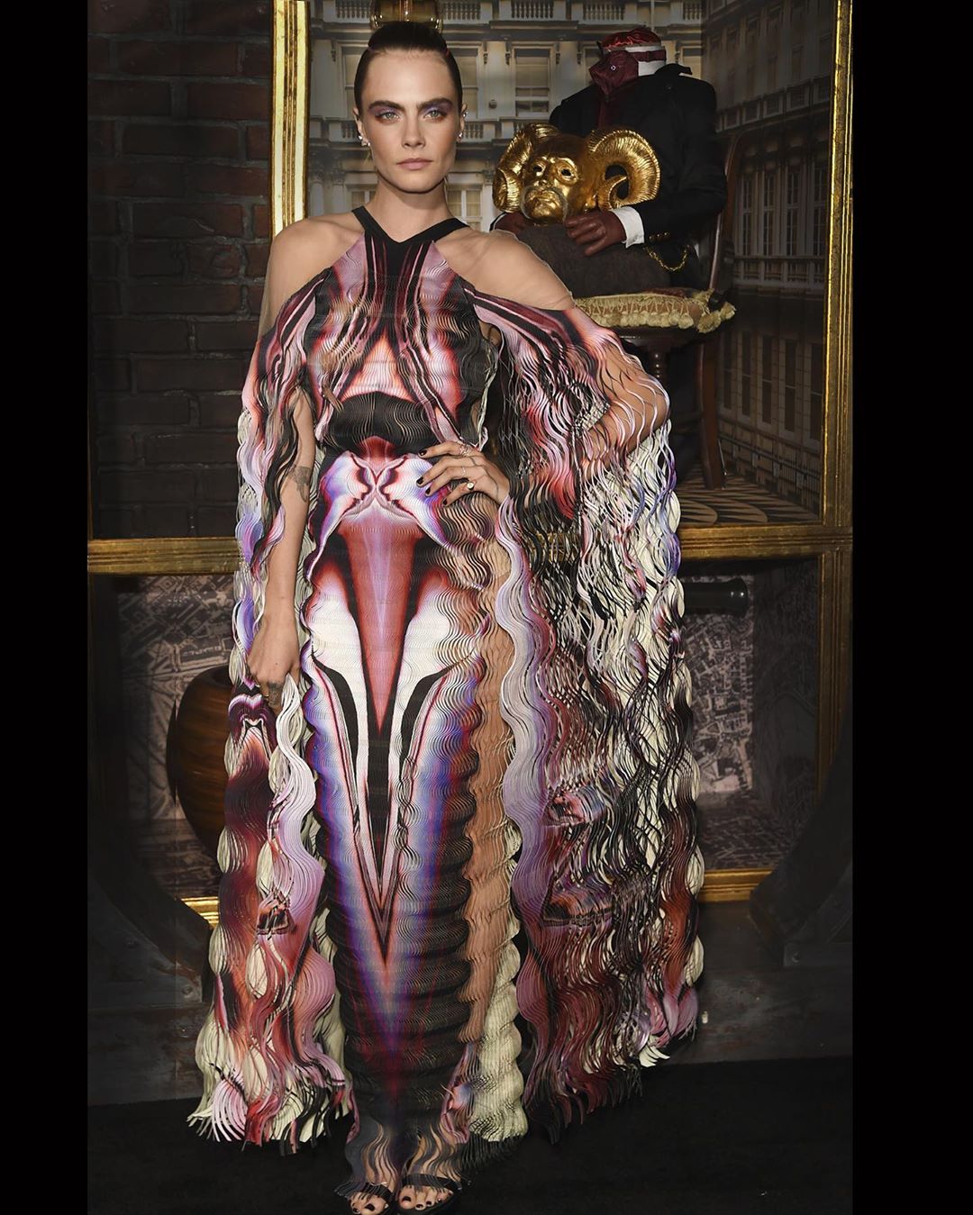 Cara Delevingne wearing the line's sweeping ripple construction