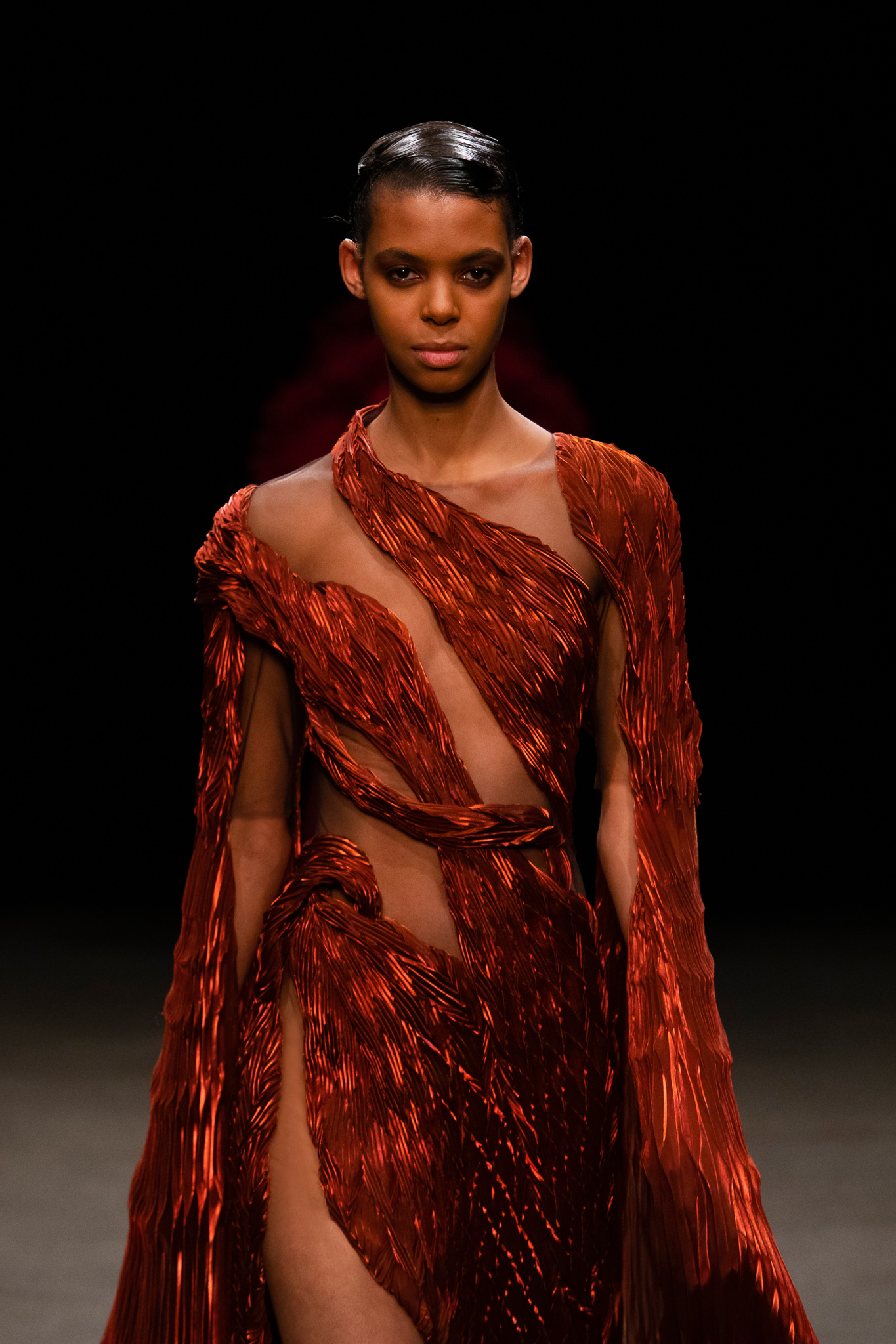 Second official runway image showing the line's sculpted volume