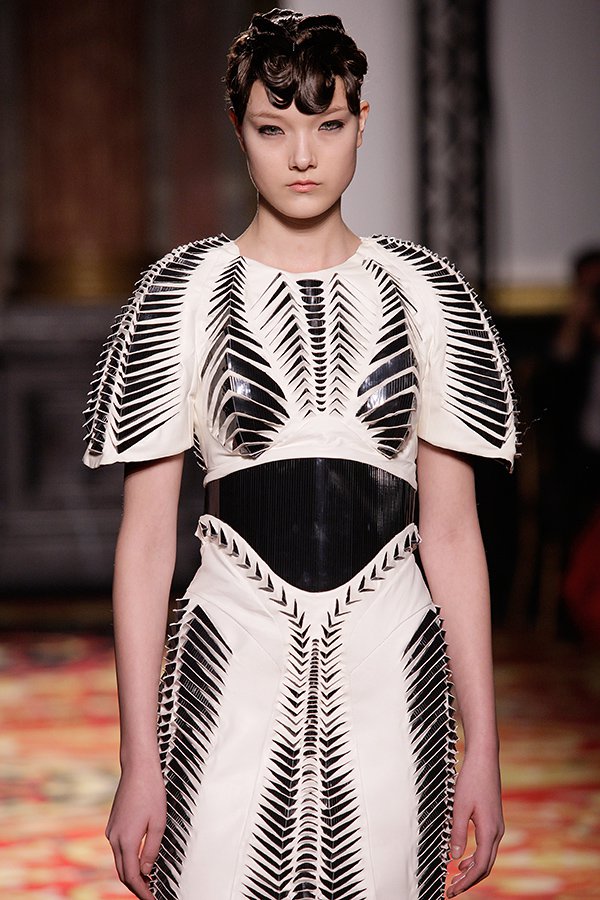 Close runway crop with the collection's ribbed, conductive-looking bodice