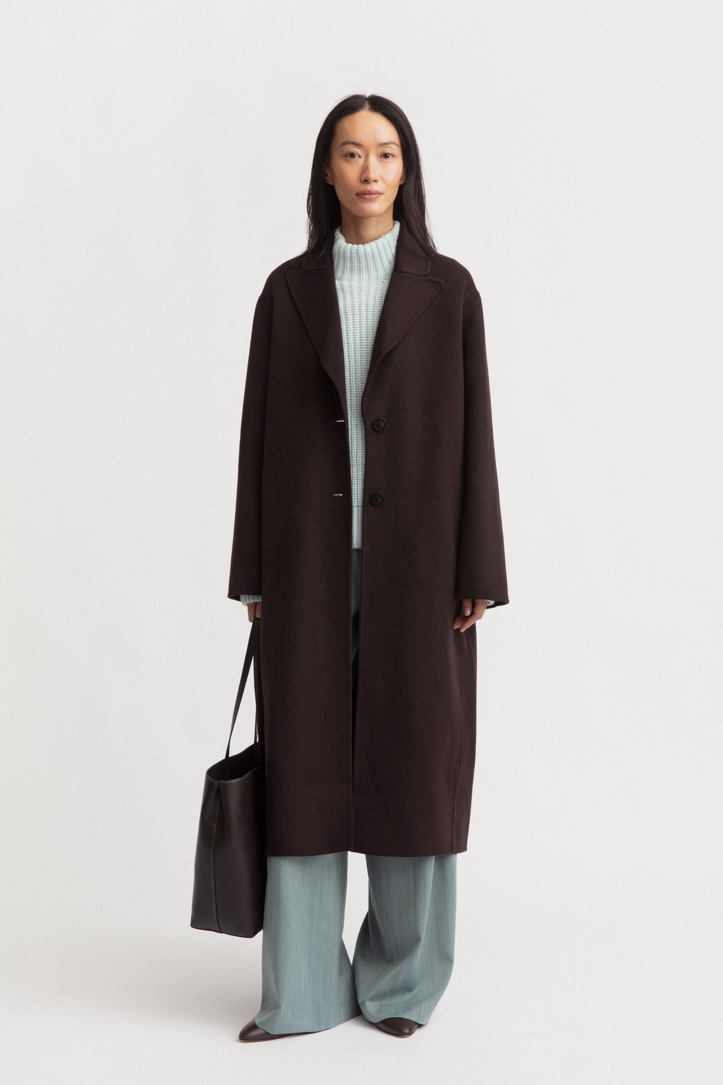 Full look shot with the coat worn open