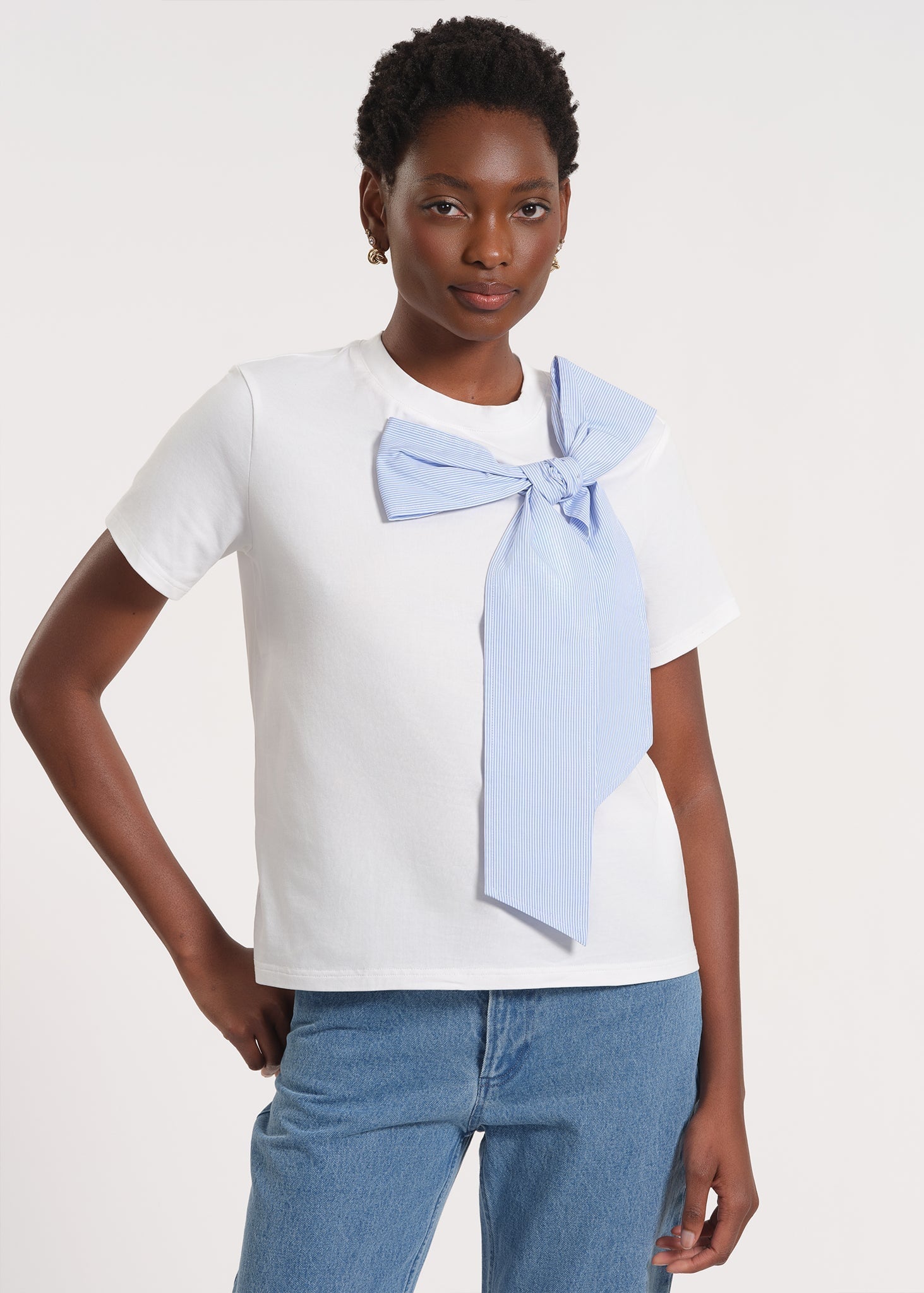 Clean front silhouette with the bow offset at the shoulder