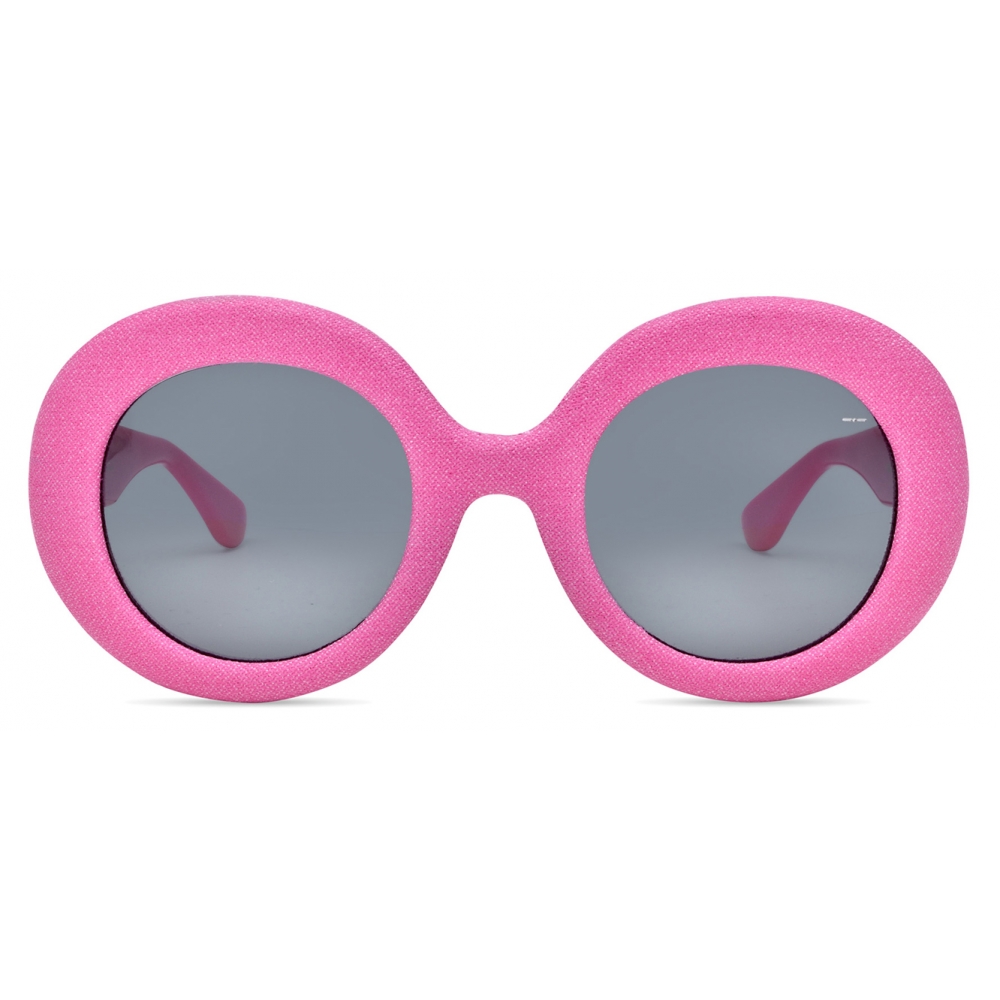 Head-on pink view emphasizing the circular lenses
