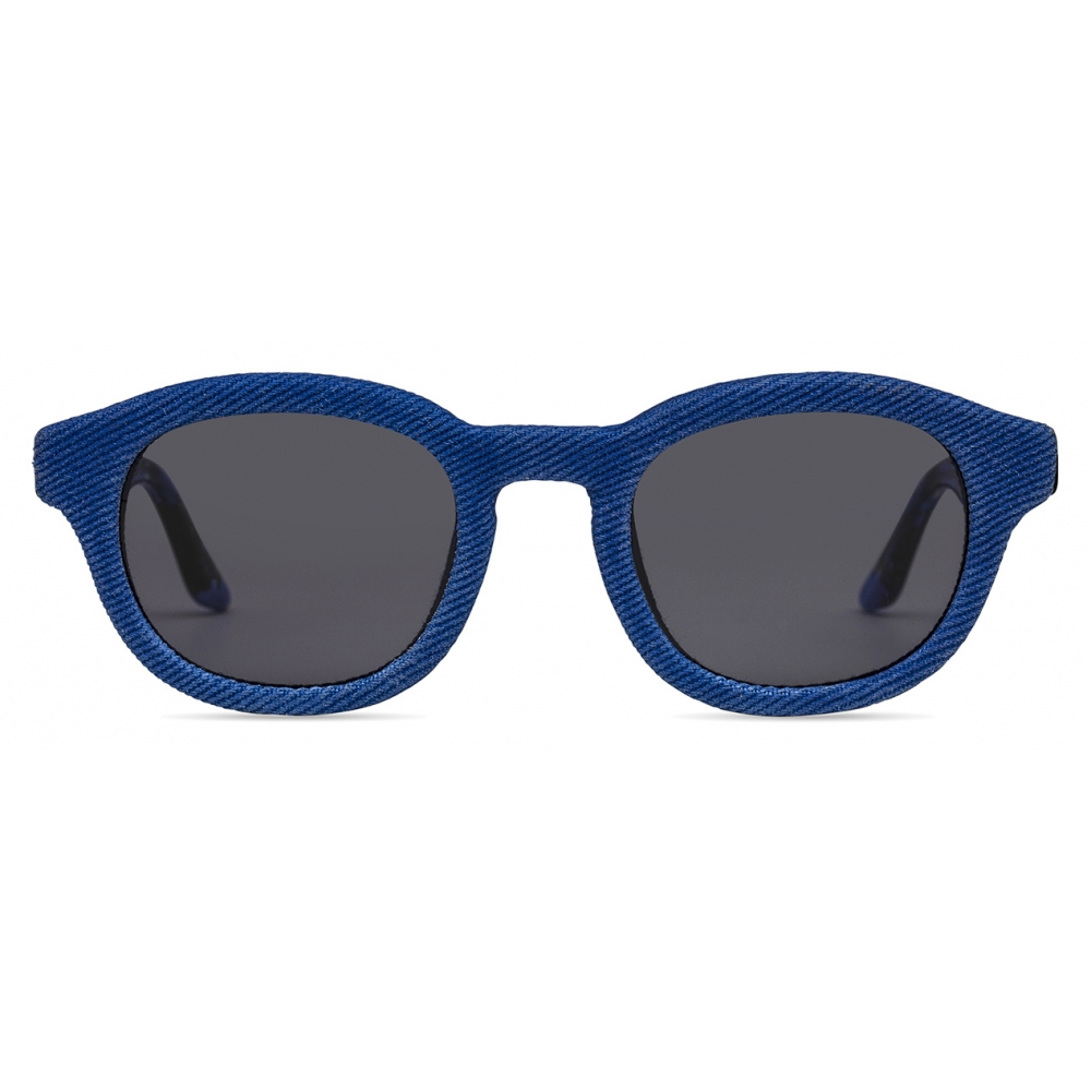 Head-on denim view emphasizing the rounded cat-eye lift