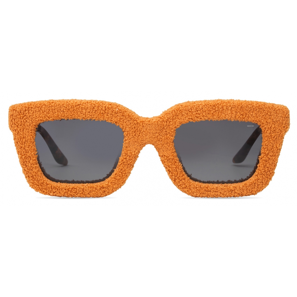 Head-on tangerine view with the plush finish fully visible