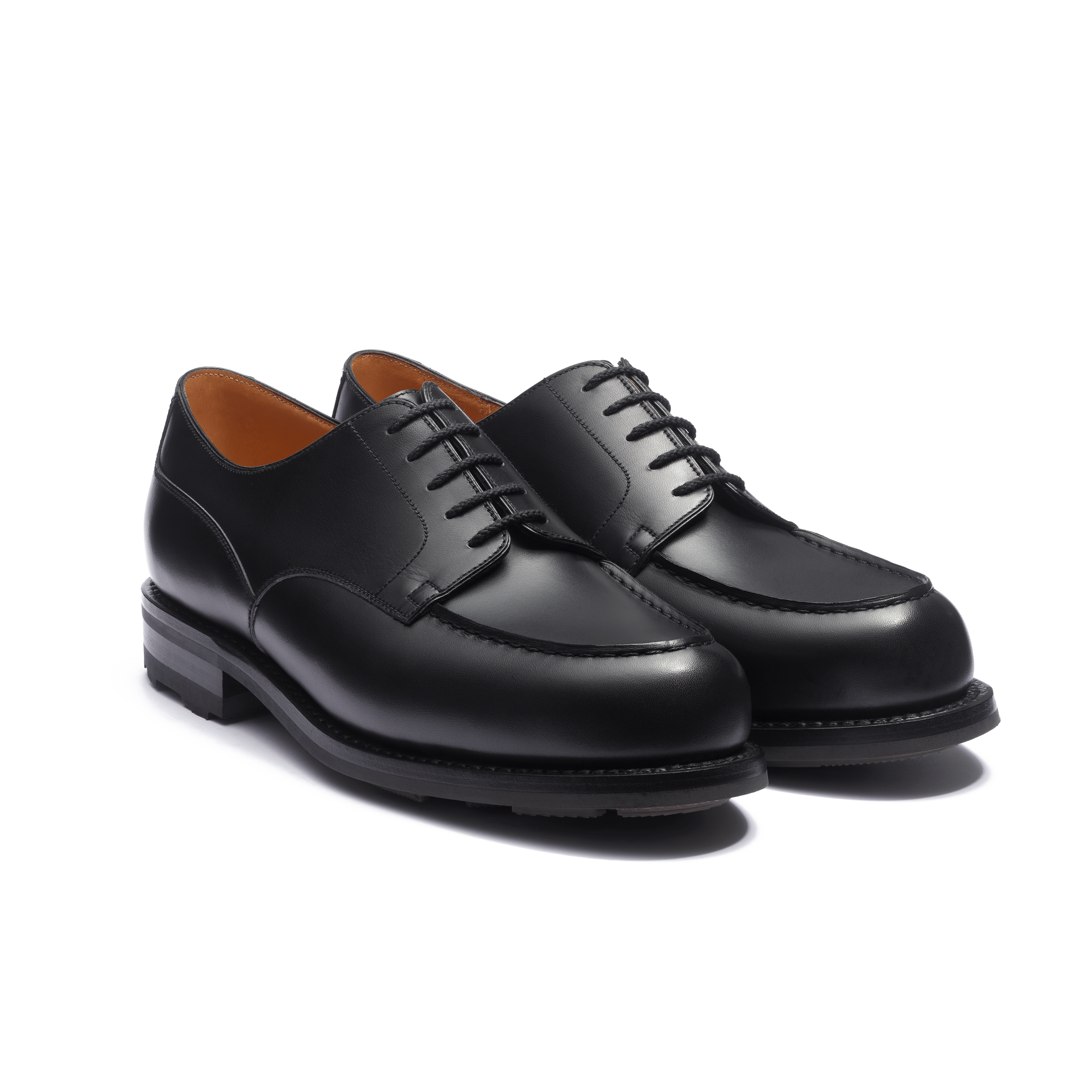 Black pair highlighting the round toe and apron