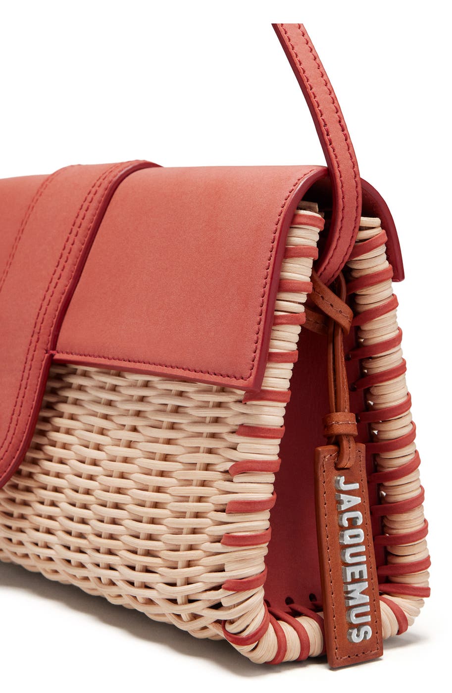 Closeup of the woven edge and JACQUEMUS leather tag