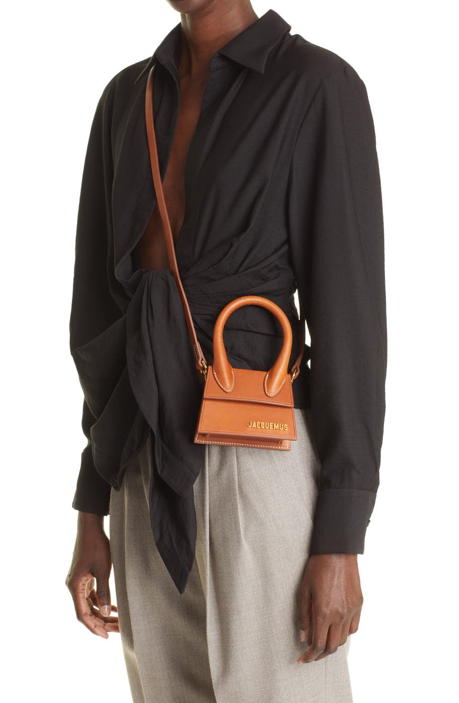 Worn crossbody — the palm-sized proportion in context